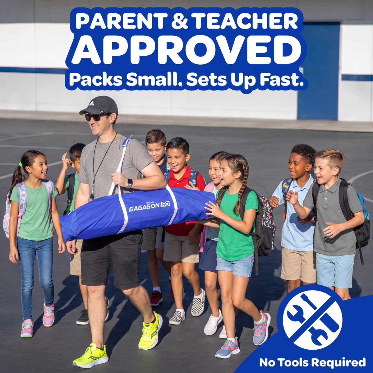 A man carrying a blue GAGAGON bag walks with a group of children outdoors on a school playground. Large text at the top reads 'PARENT & TEACHER APPROVED Packs Small.