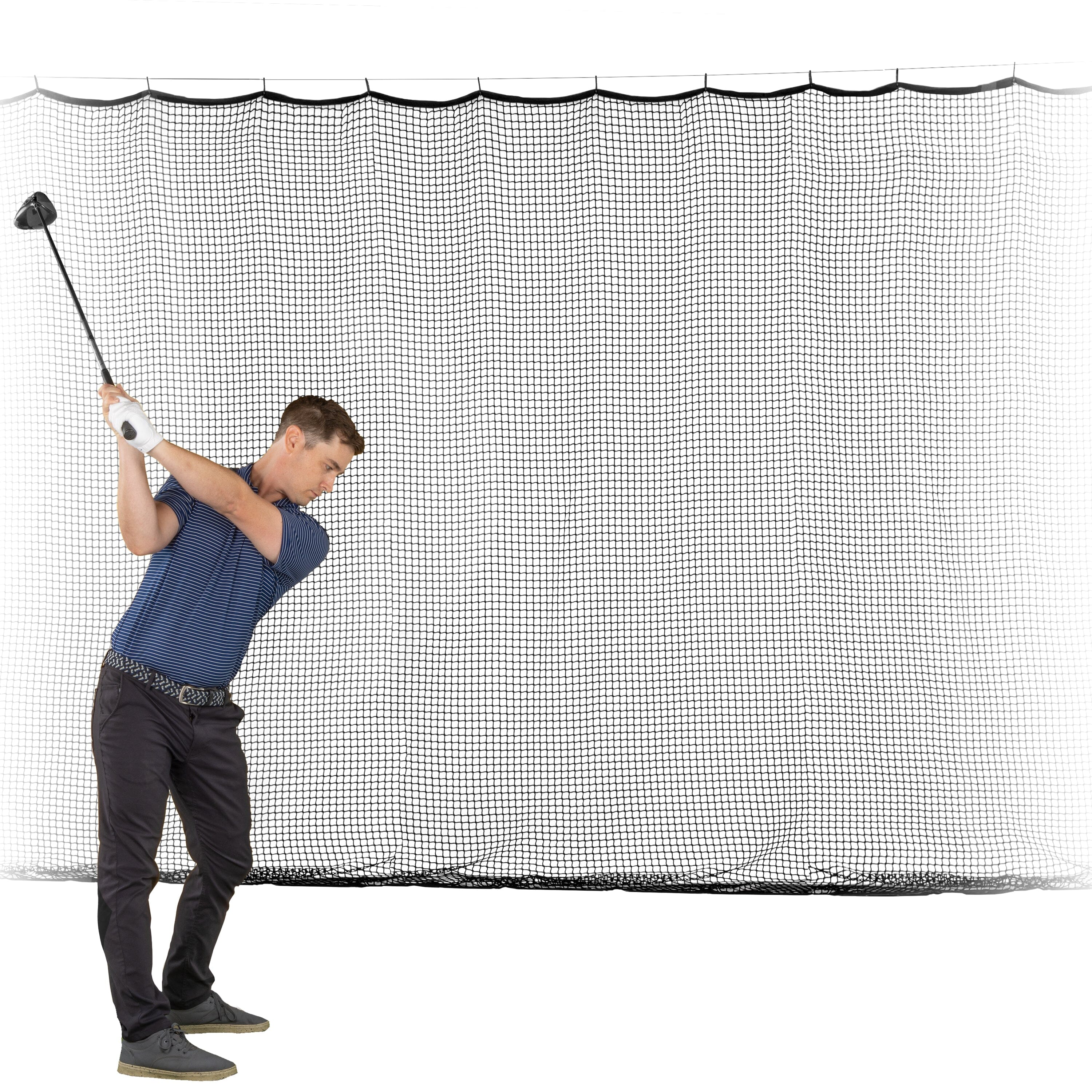 a man hitting a golf ball on a net