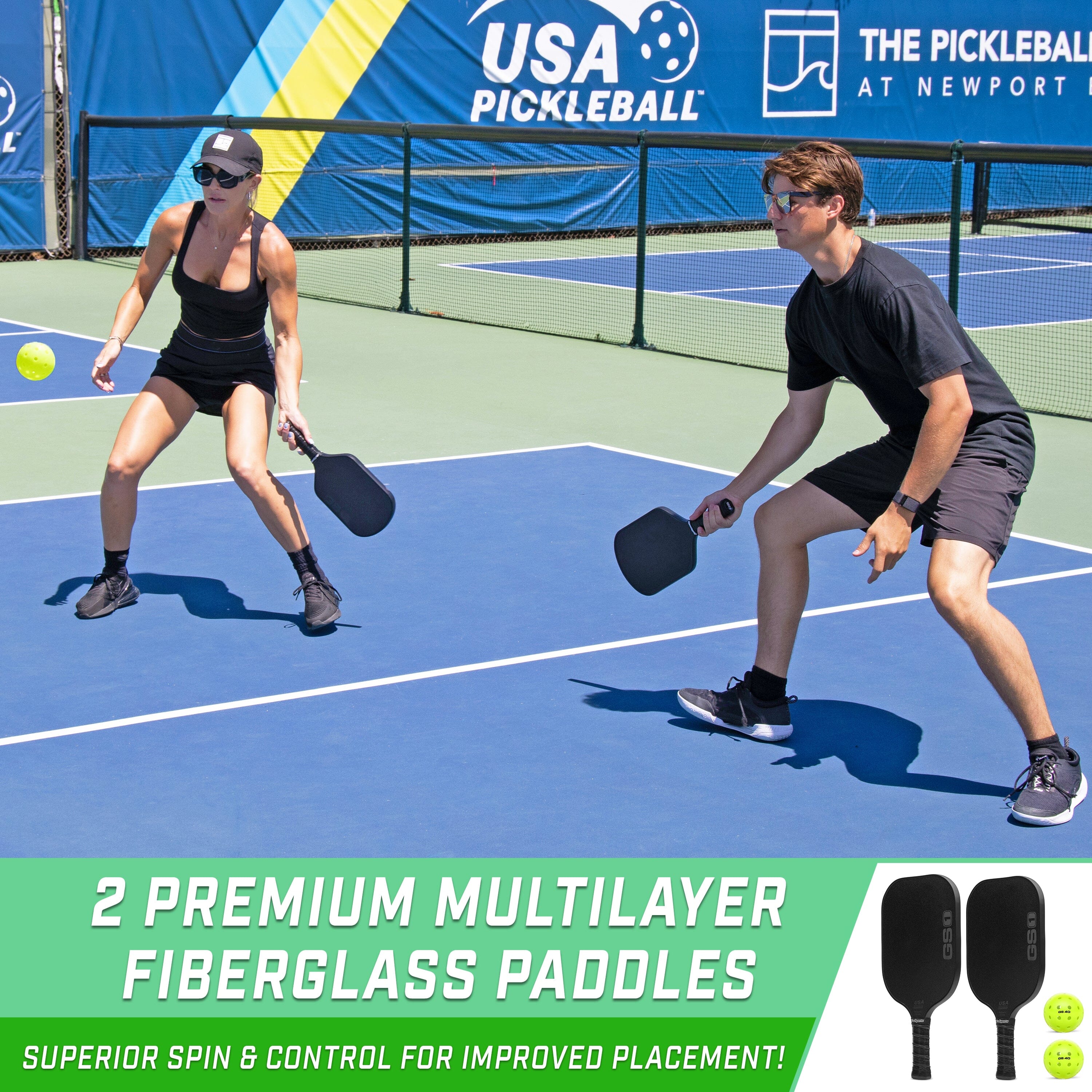 two people playing tennis on a tennis court