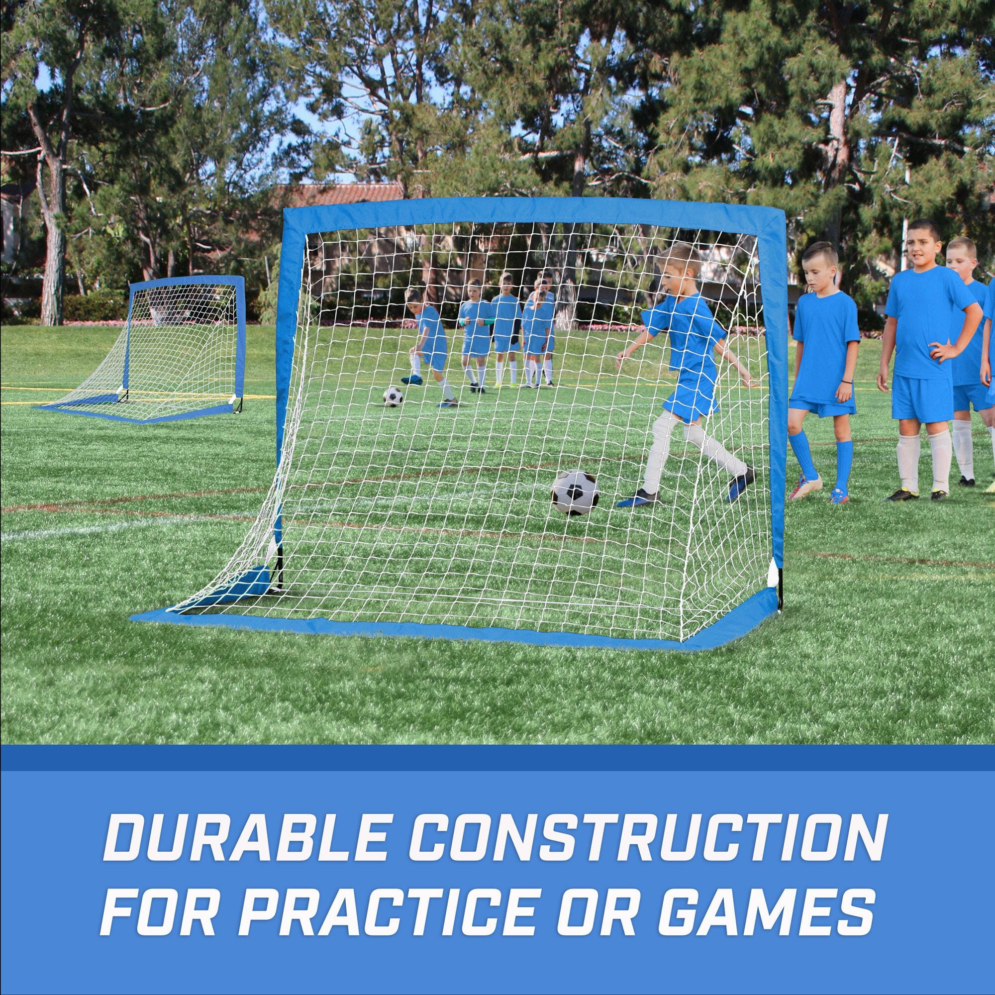 a soccer goal with a blue net and two boys playing soccer