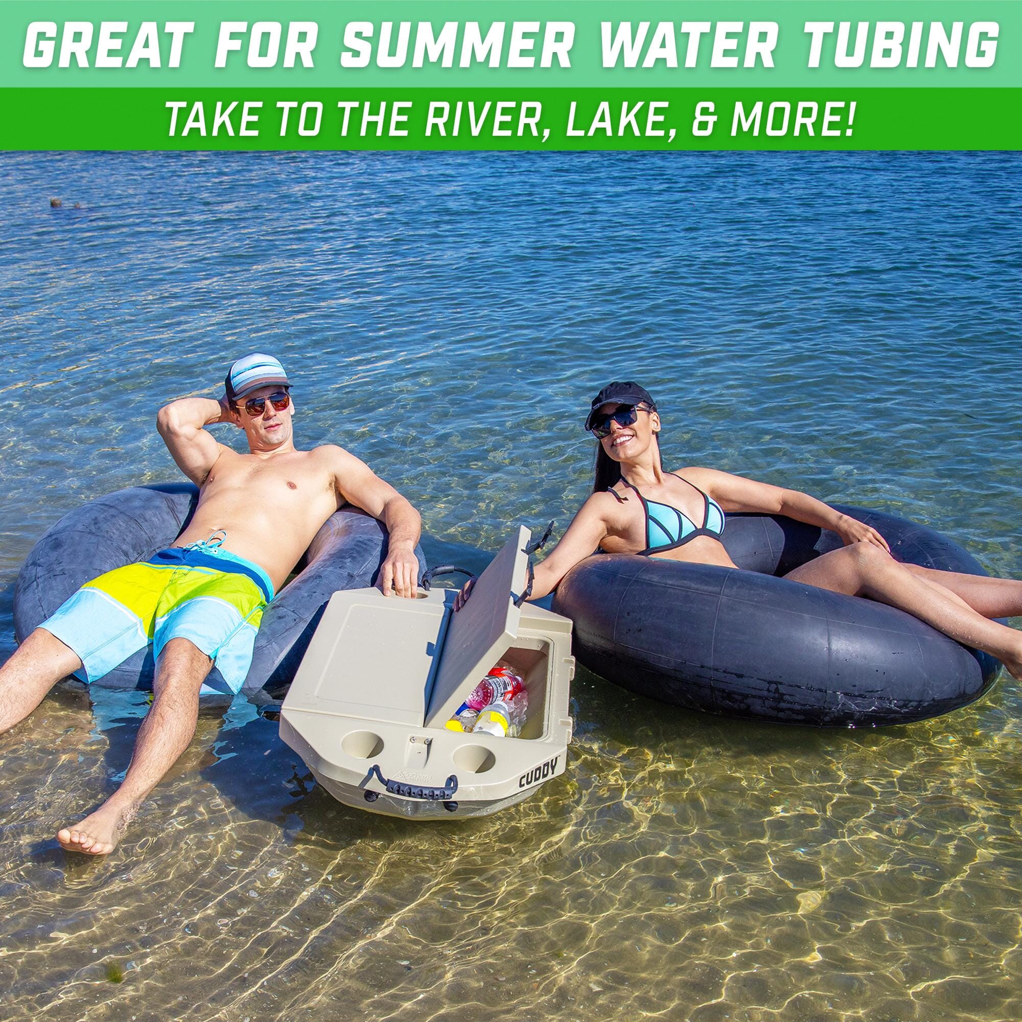 two people floating in the water with a boat