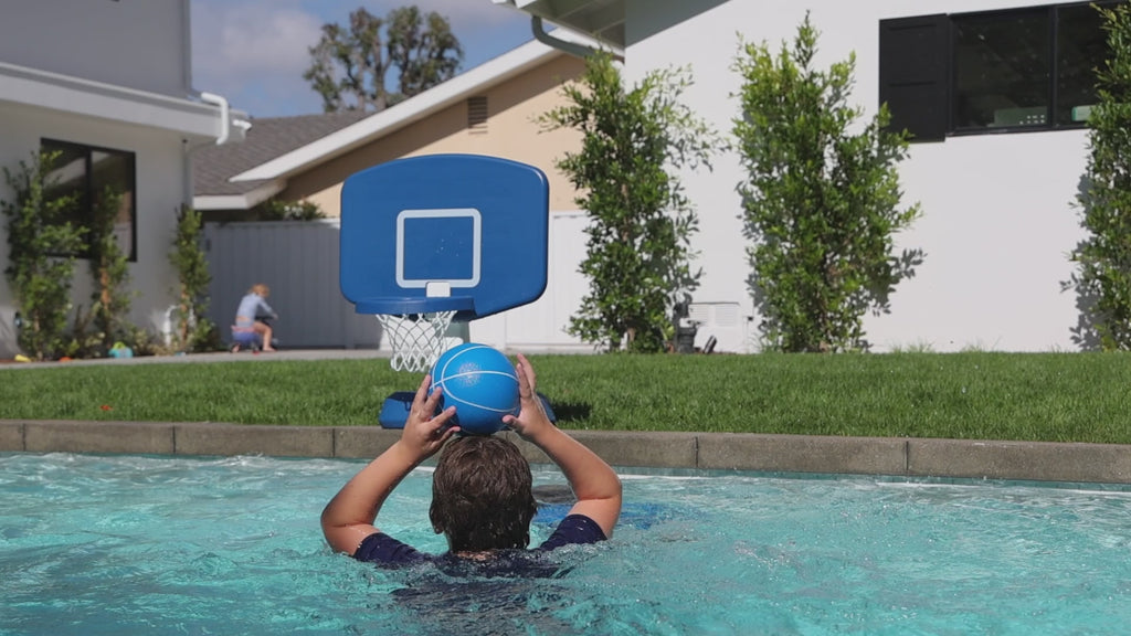 People playing basketball in pool