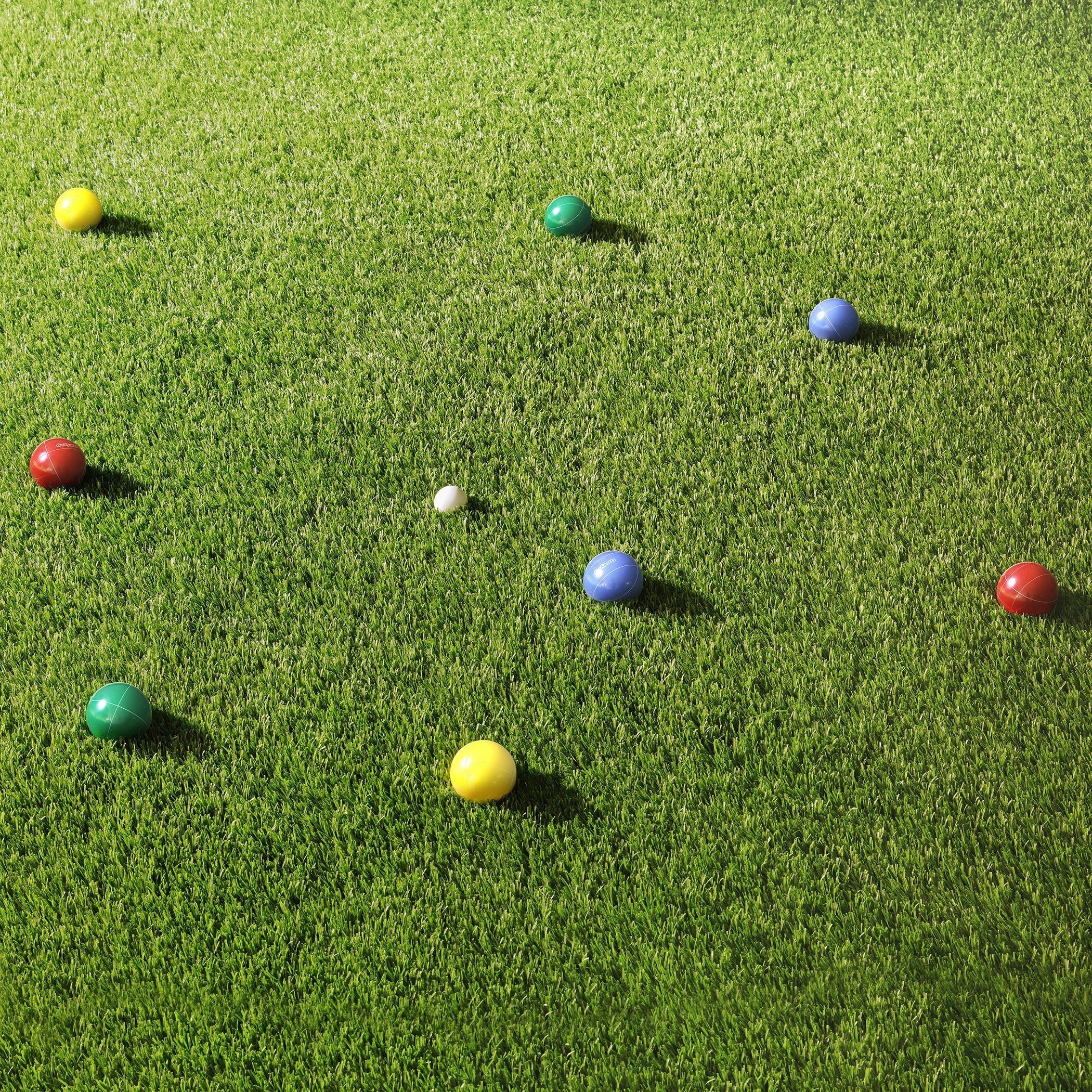 a group of balls on the grass