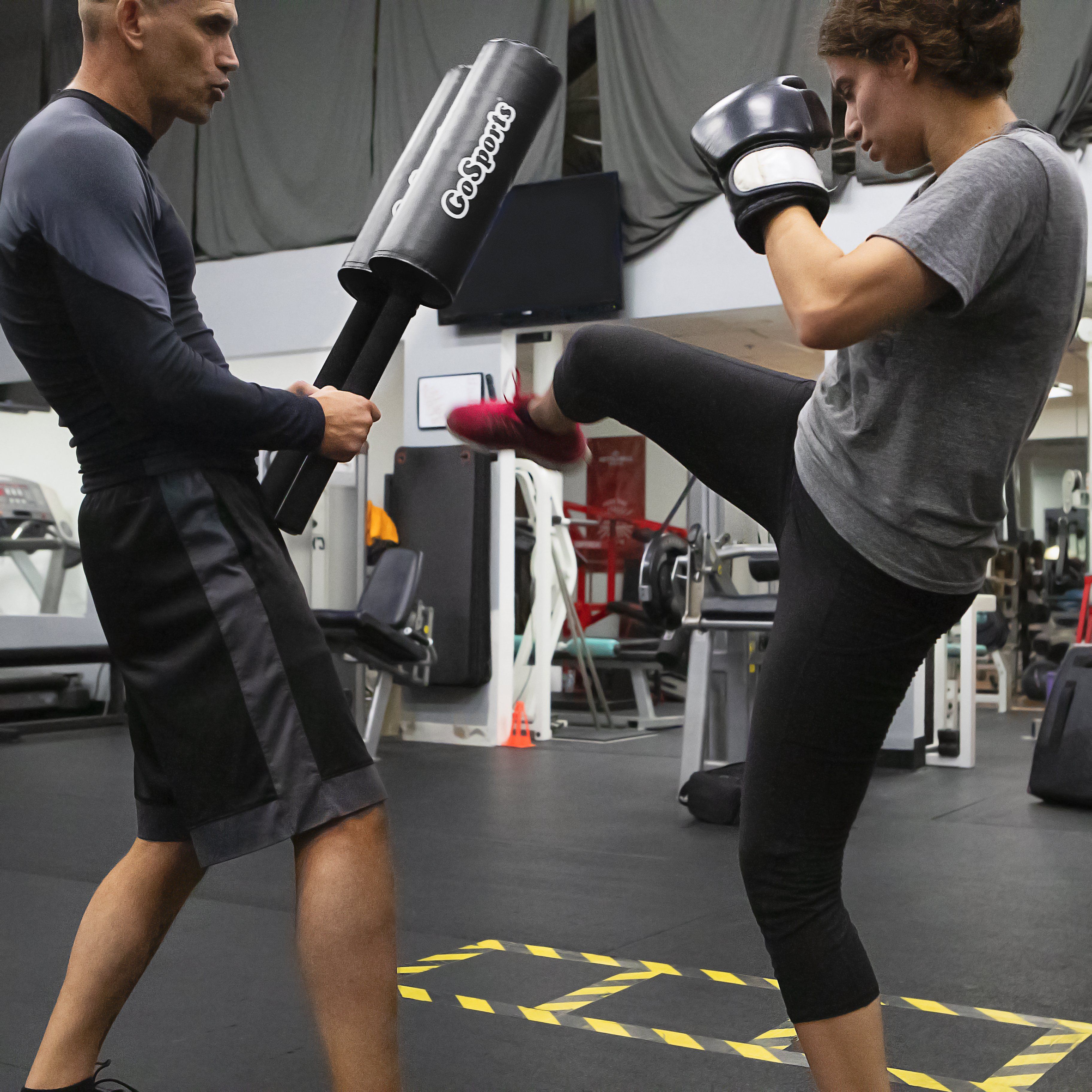 a man and woman in a gym setting
