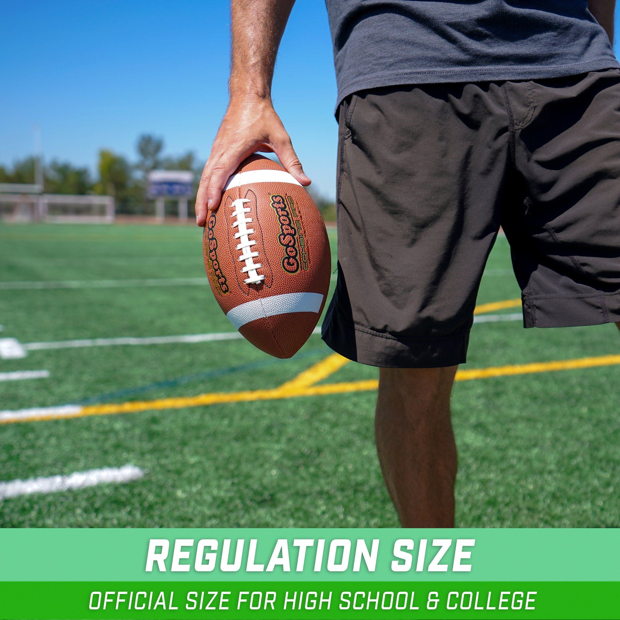 a man holding a football on a field