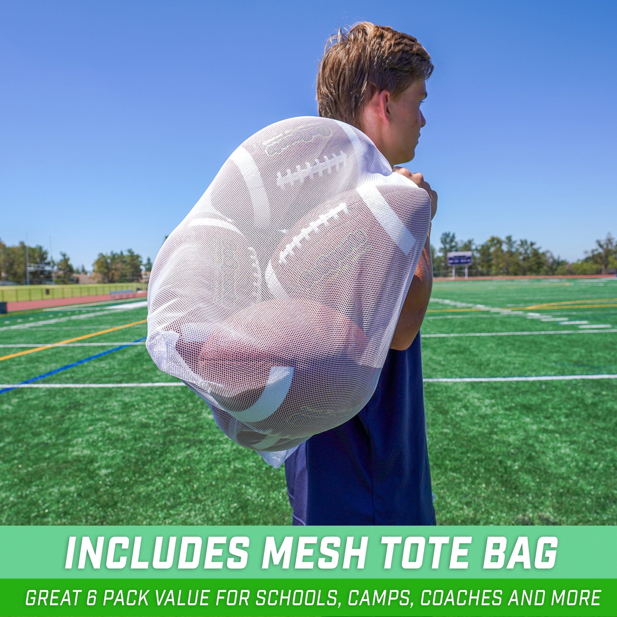 a boy holding a football in his hands