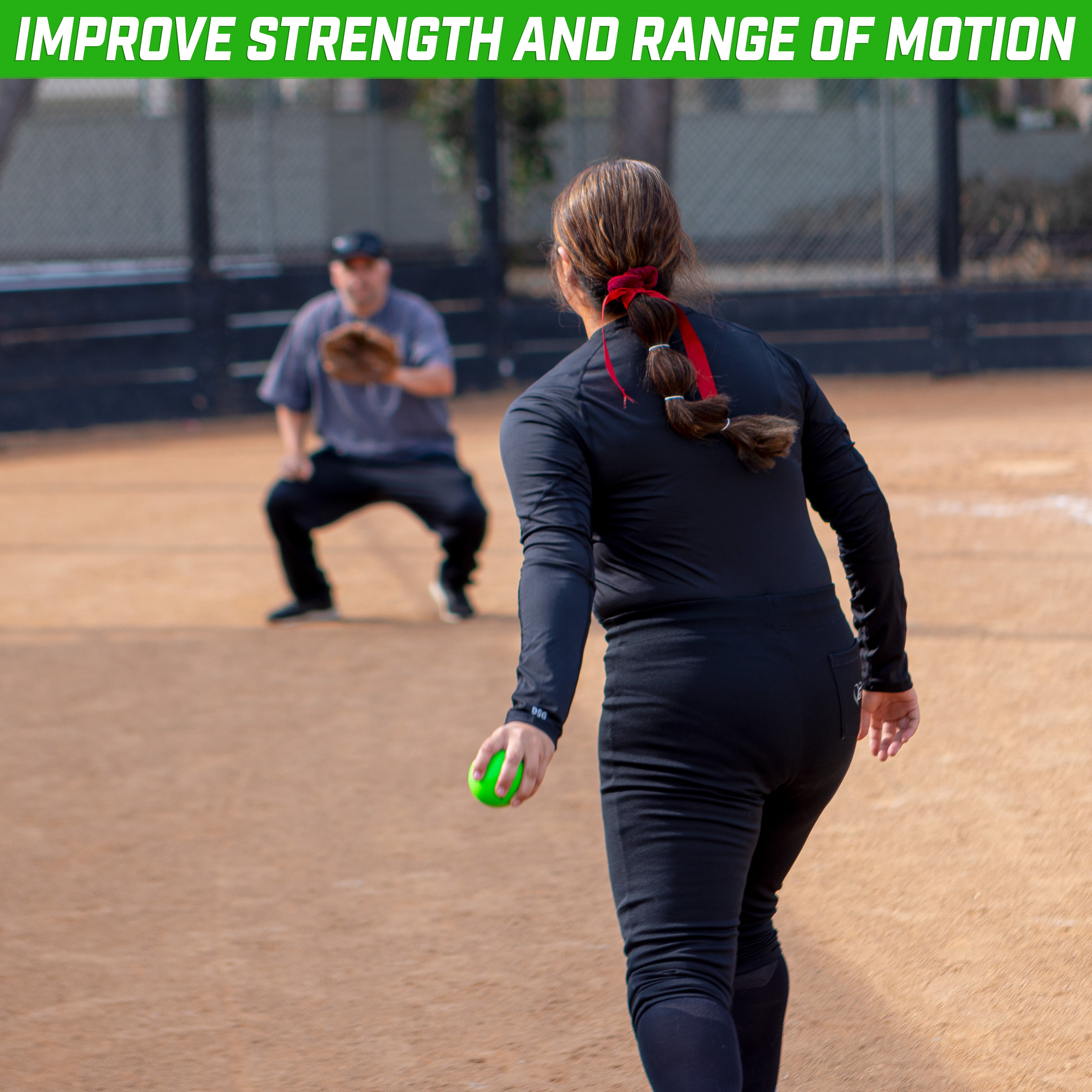 a woman in a black outfit is playing softball