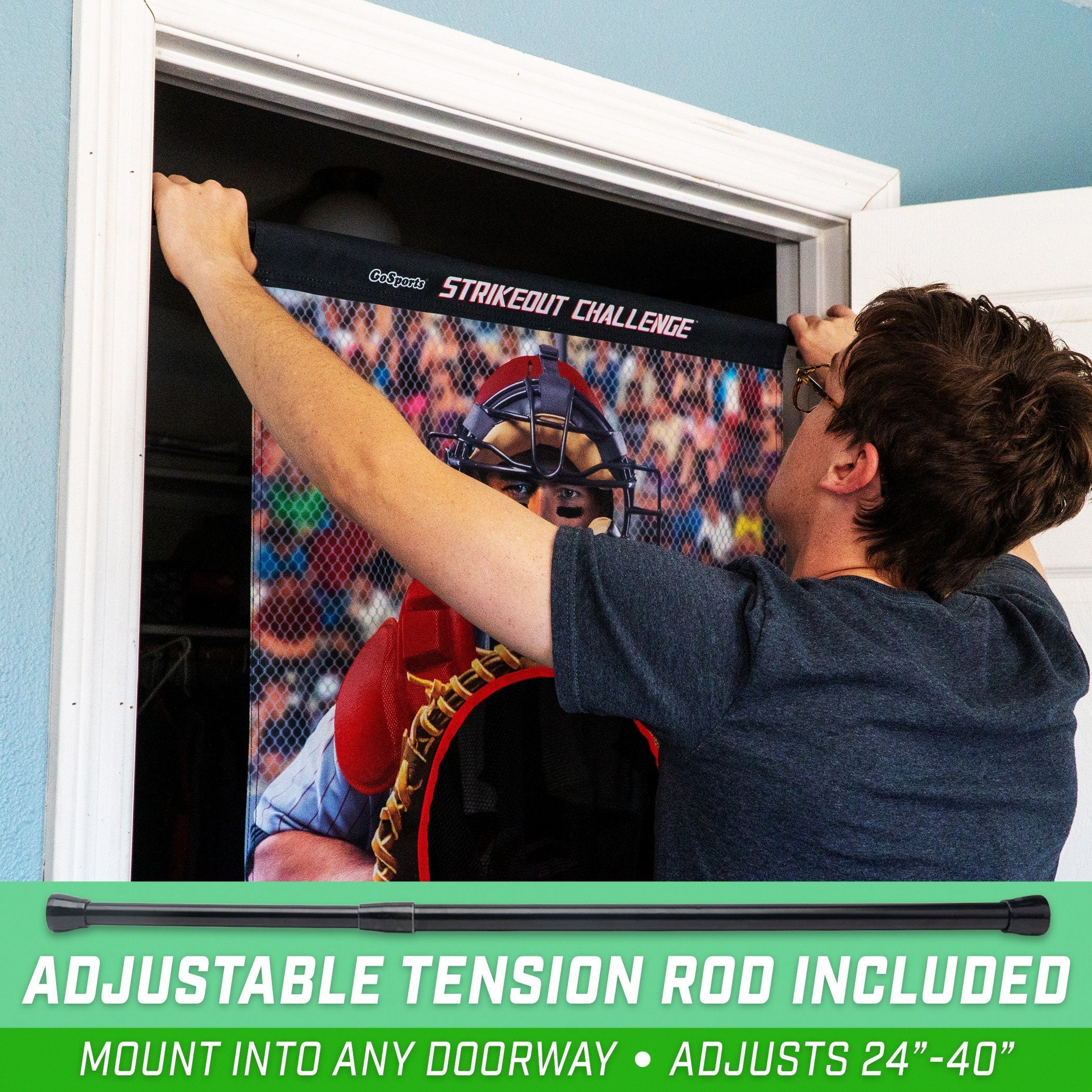 a man is putting a baseball glove on a wall