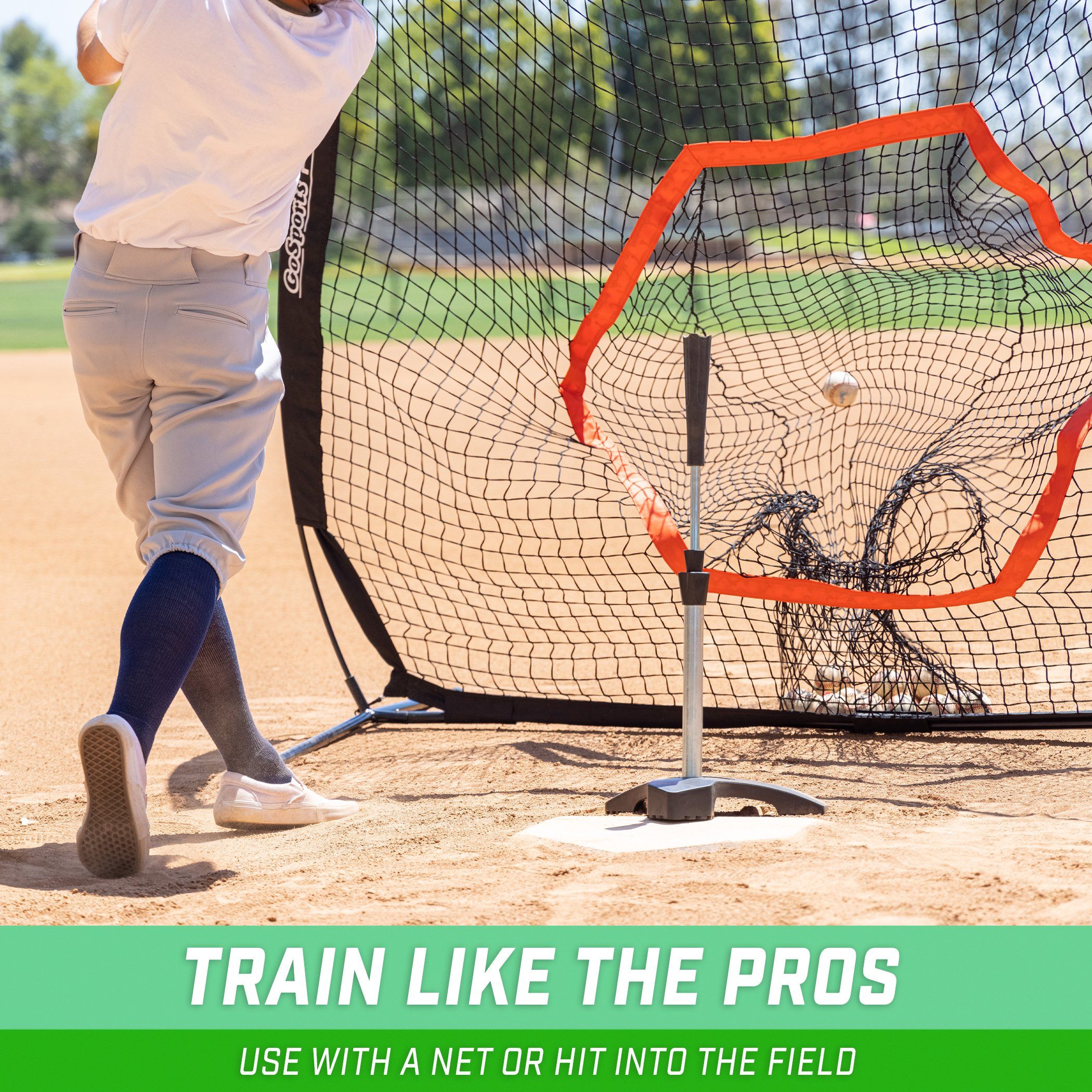 a young boy is hitting a baseball with a bat
