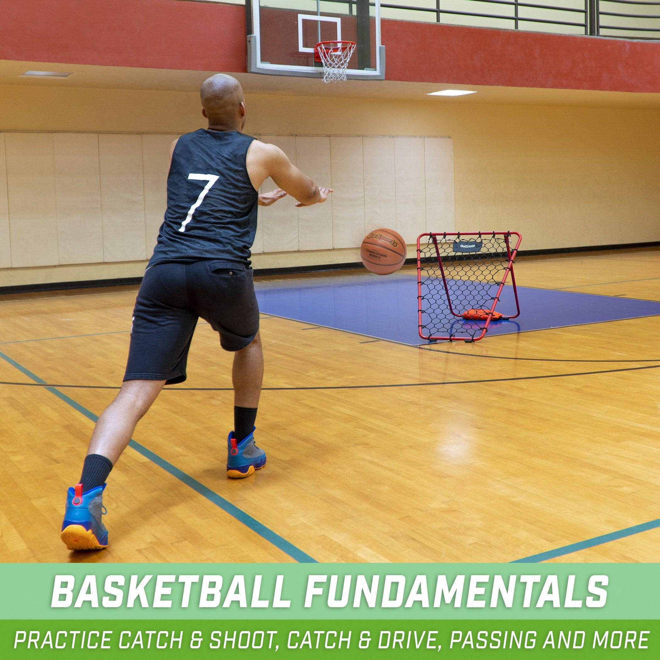 a man in a blue shirt is playing basketball