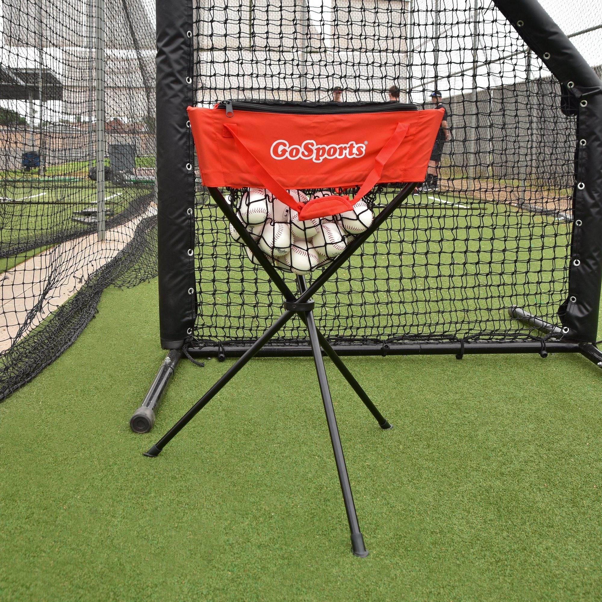 a baseball field with a baseball and a red chair