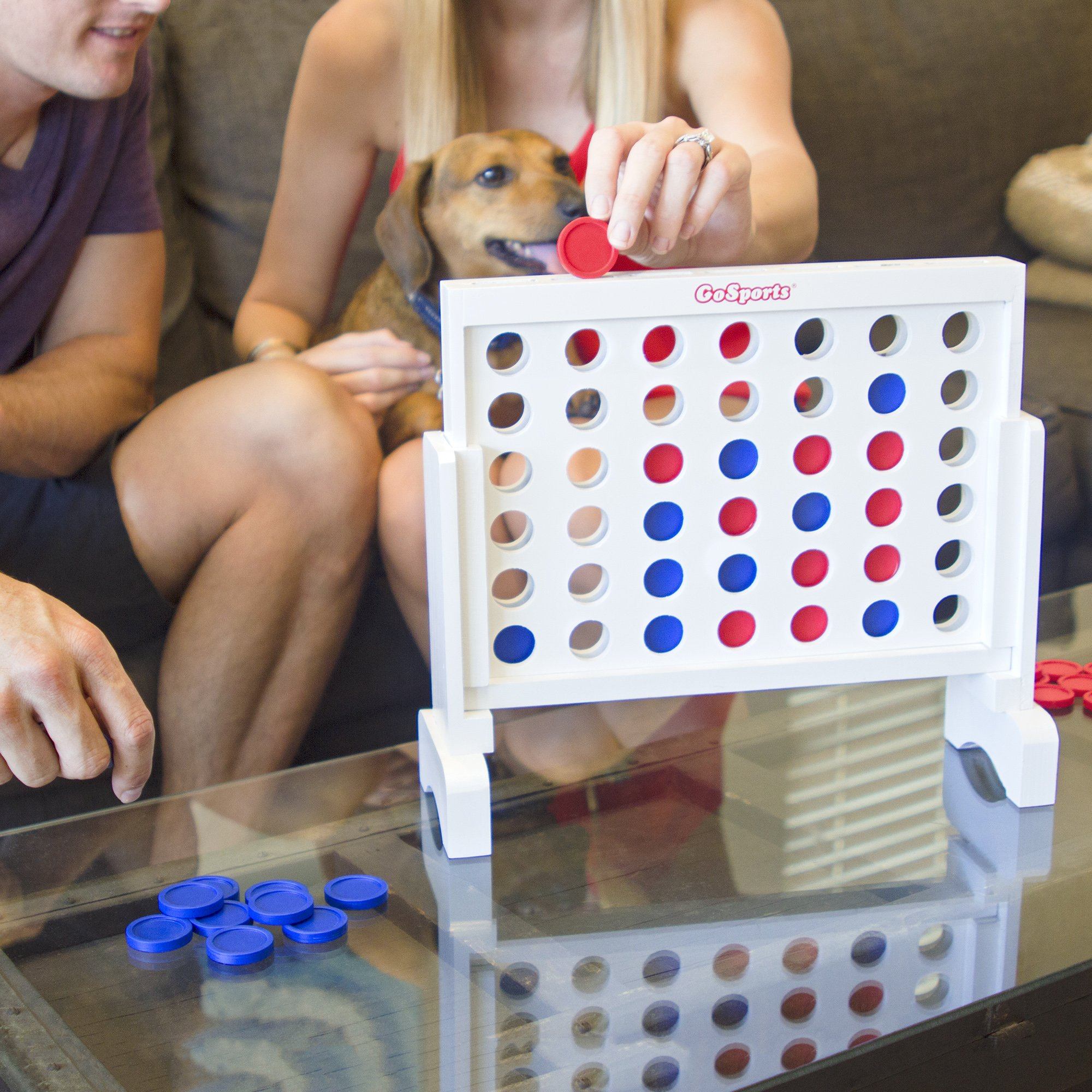 a man and woman playing a game of connect