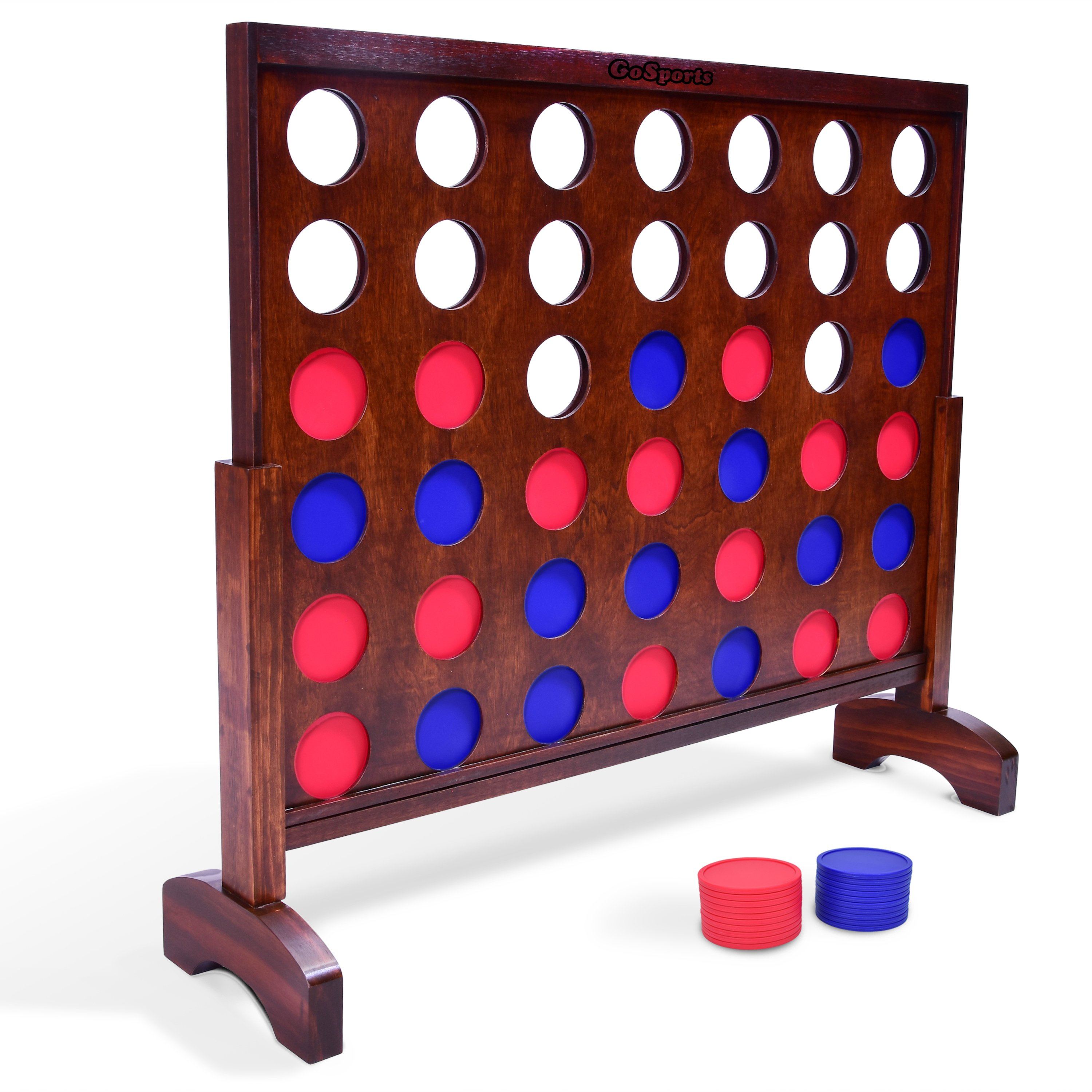 a wooden four - in - a - row game set with four red and blue circles