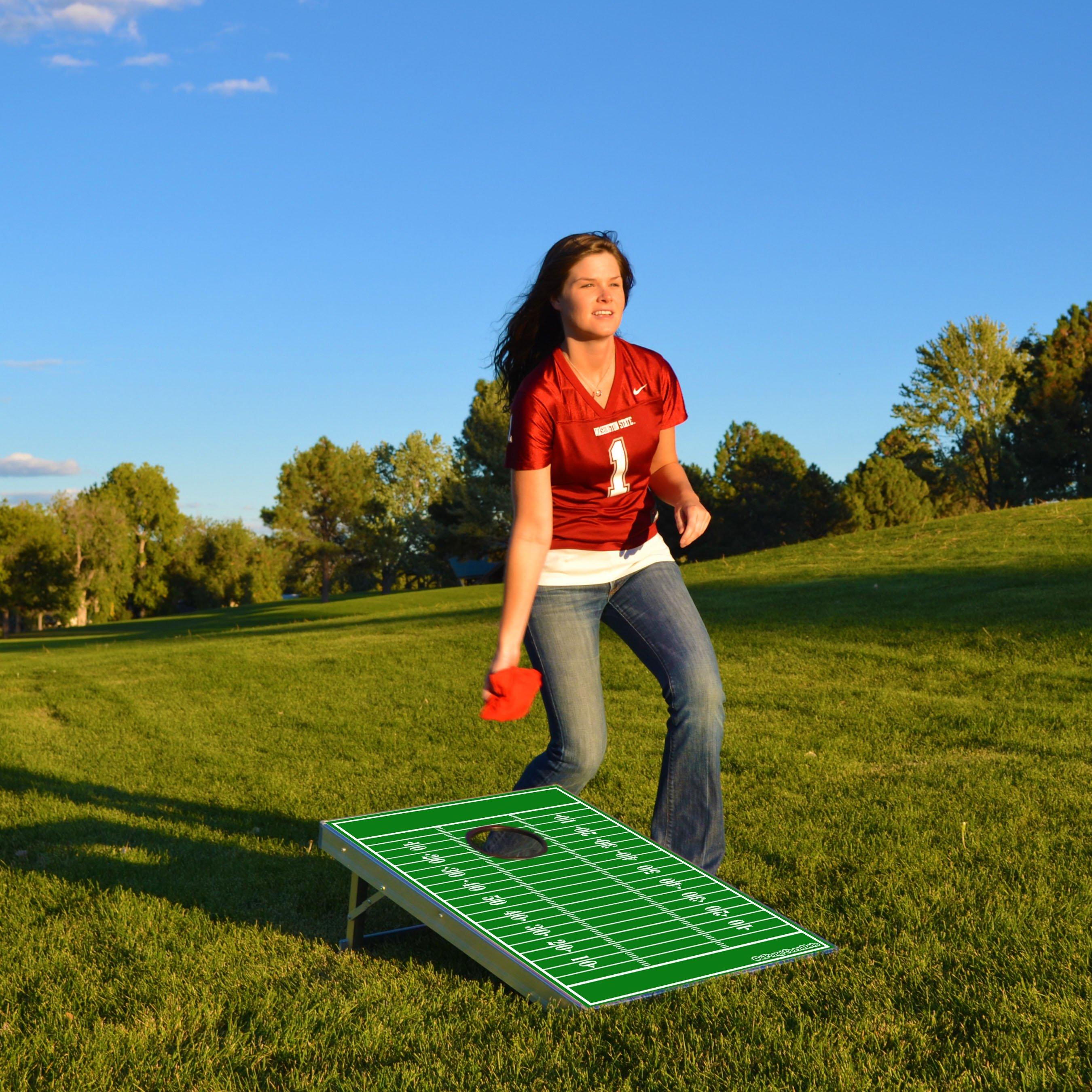 a woman in a red shirt is playing a game of football