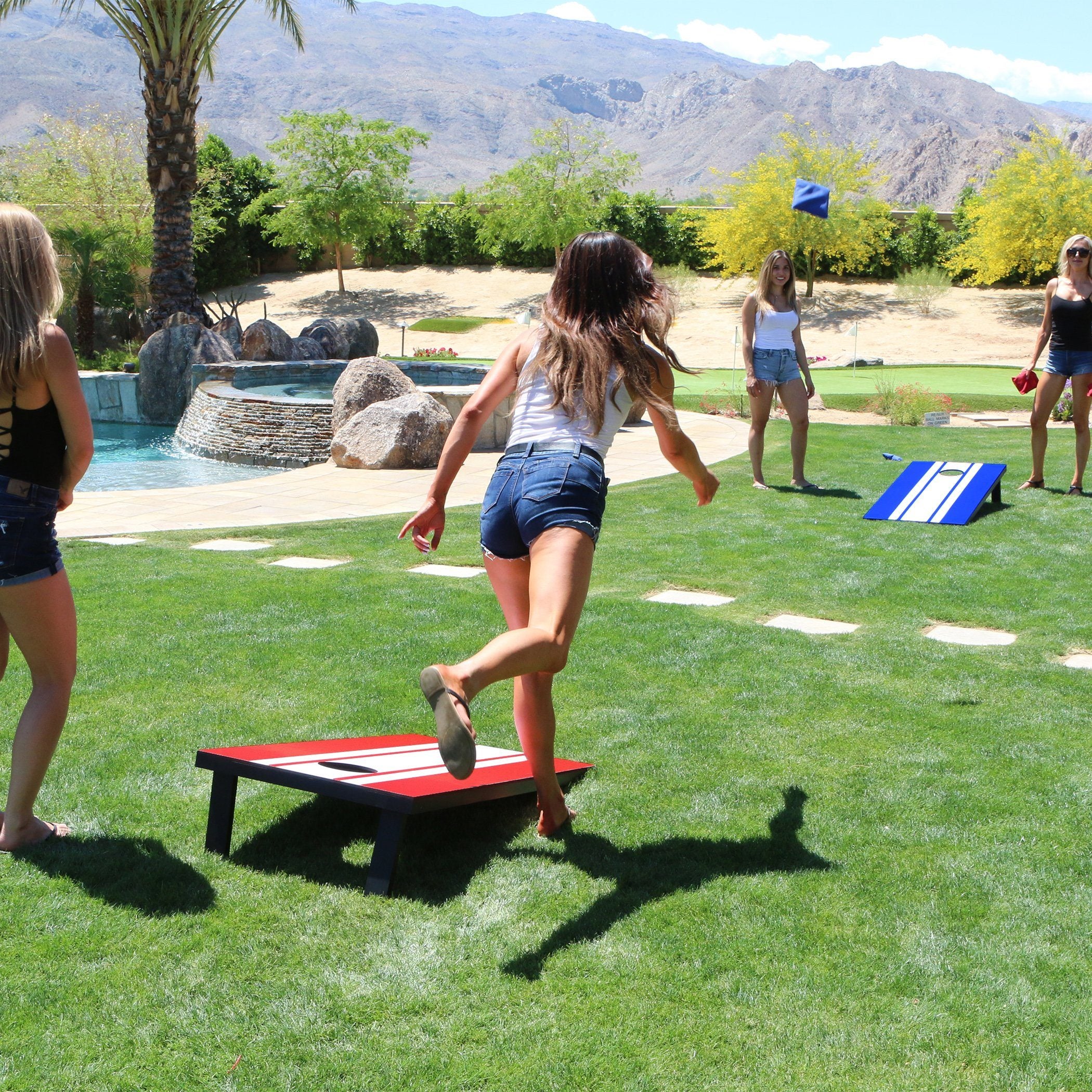 a group of girls playing corn corn games