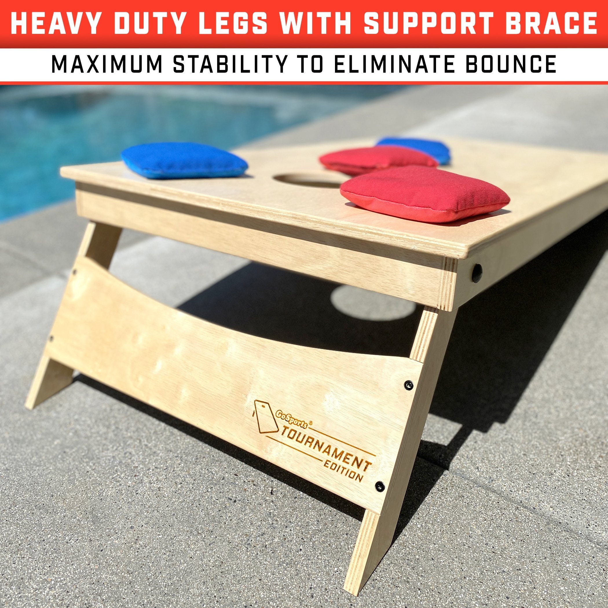 a wooden bench with a towel and mits on it