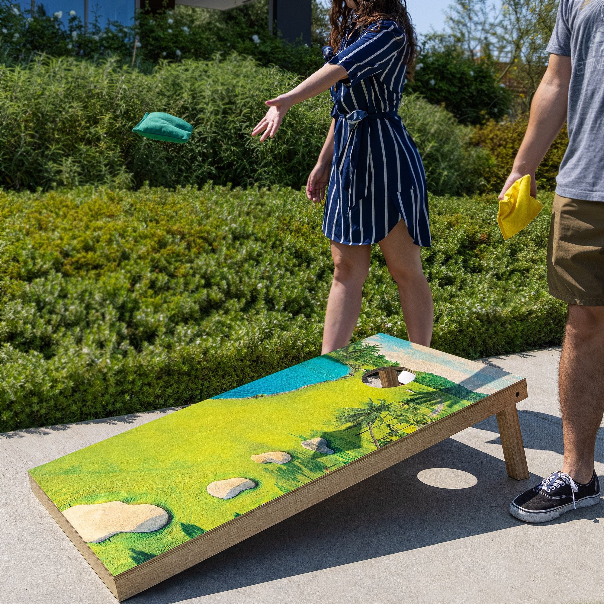 a man and woman playing a game on a skateboard