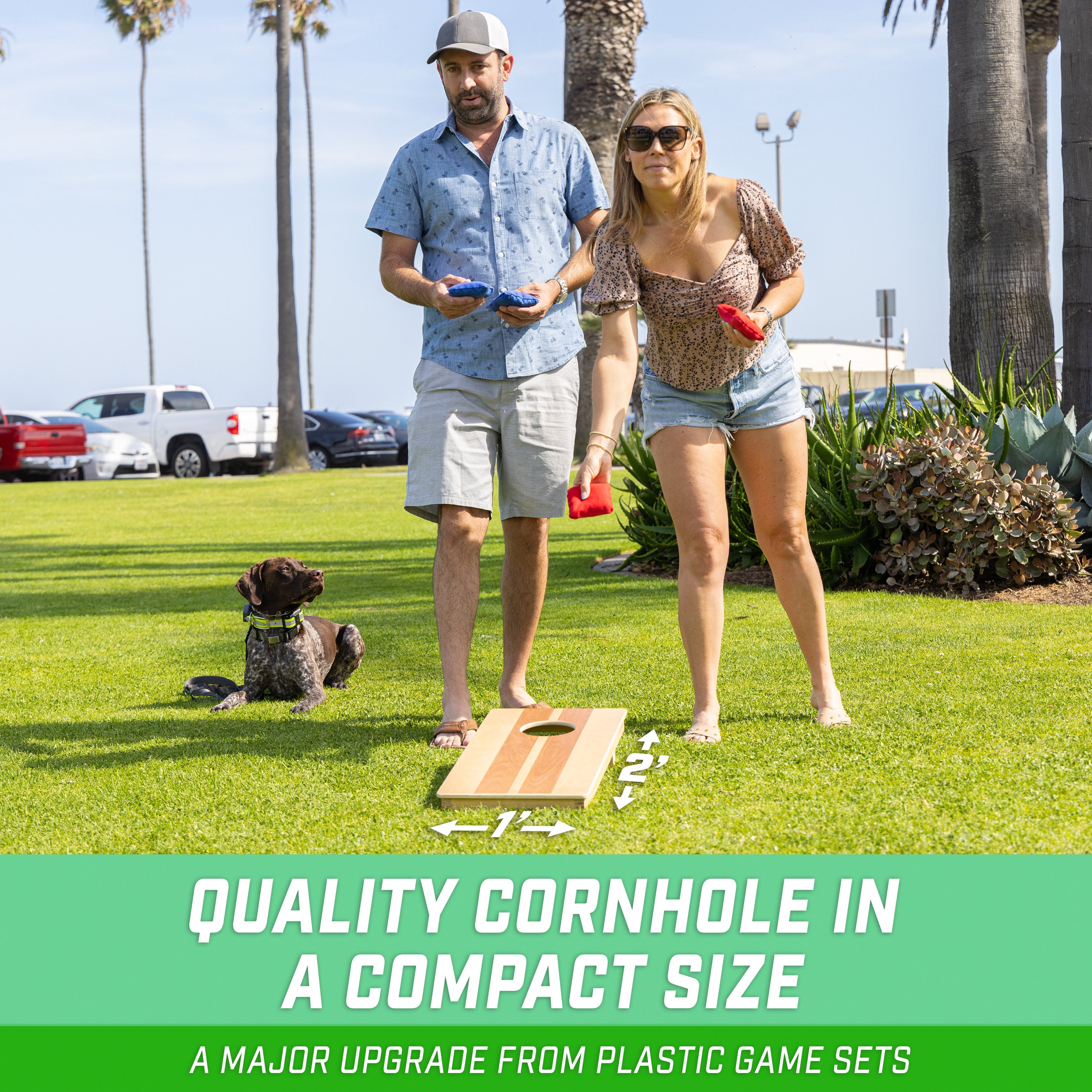 a man and woman playing a game of cornhole on grass