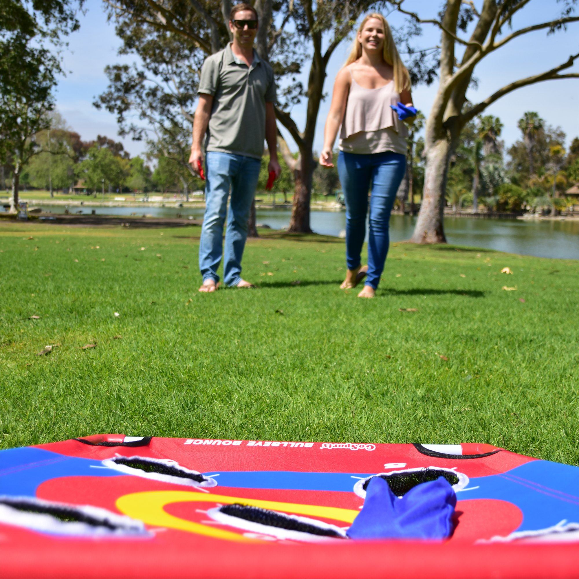 a couple walking in a park with a kite
