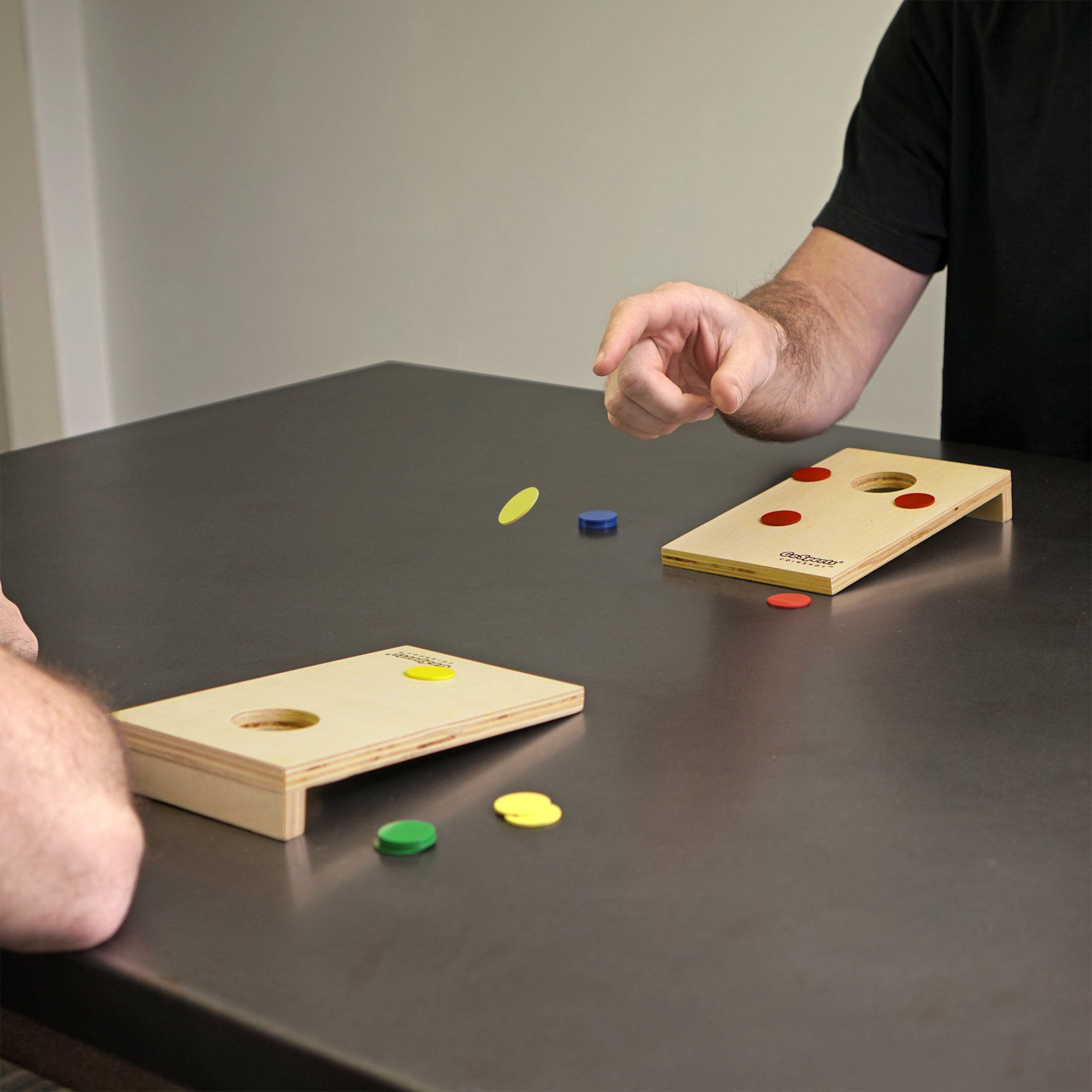 a man playing with a wooden board game