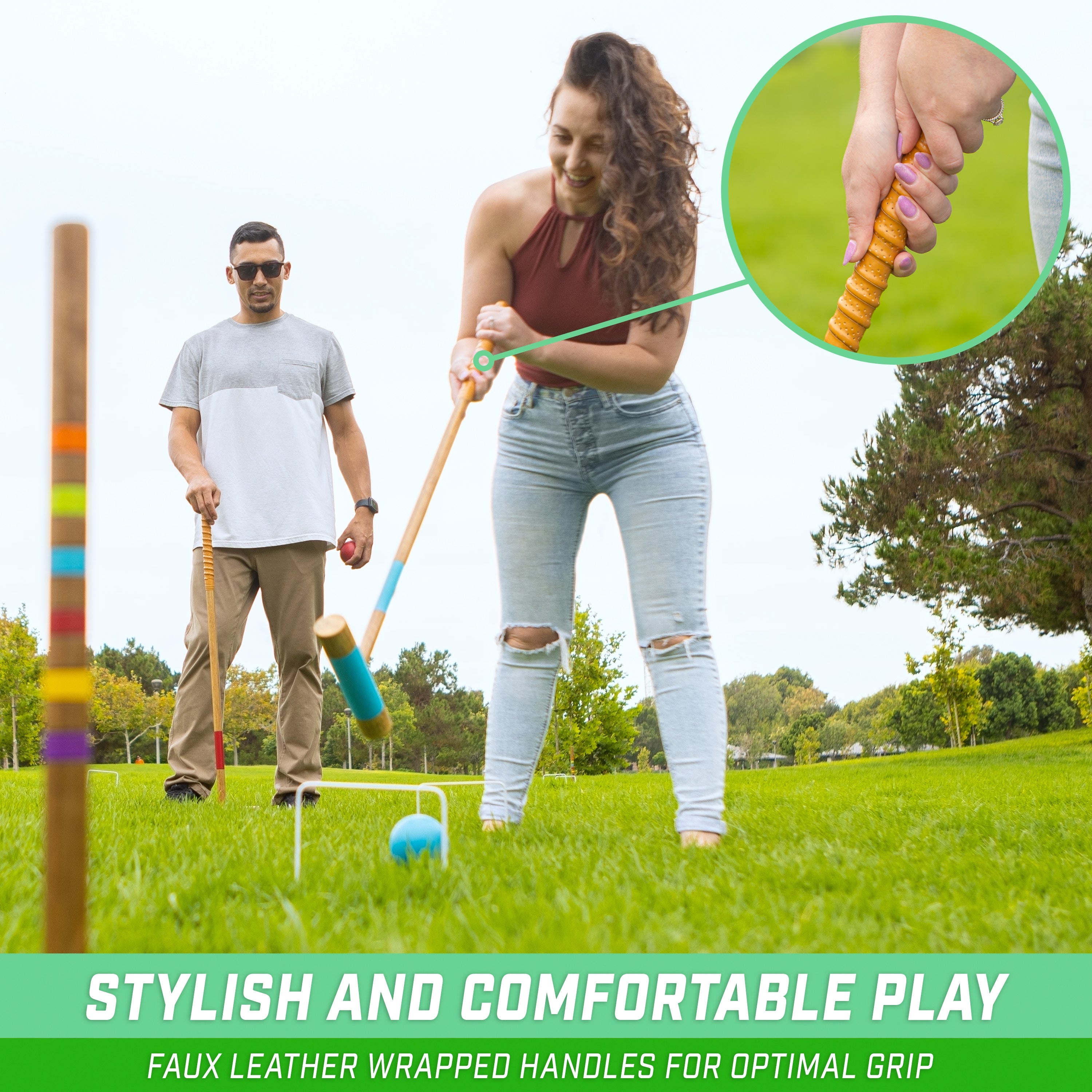 a woman is playing with a child in a field