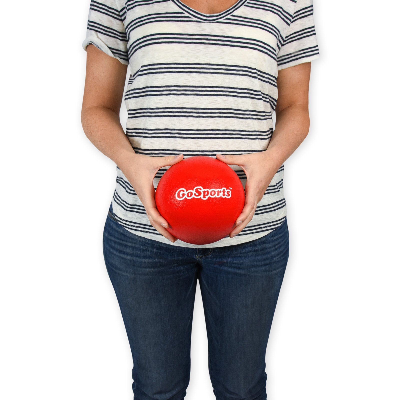 a woman holding a red ball in her hands