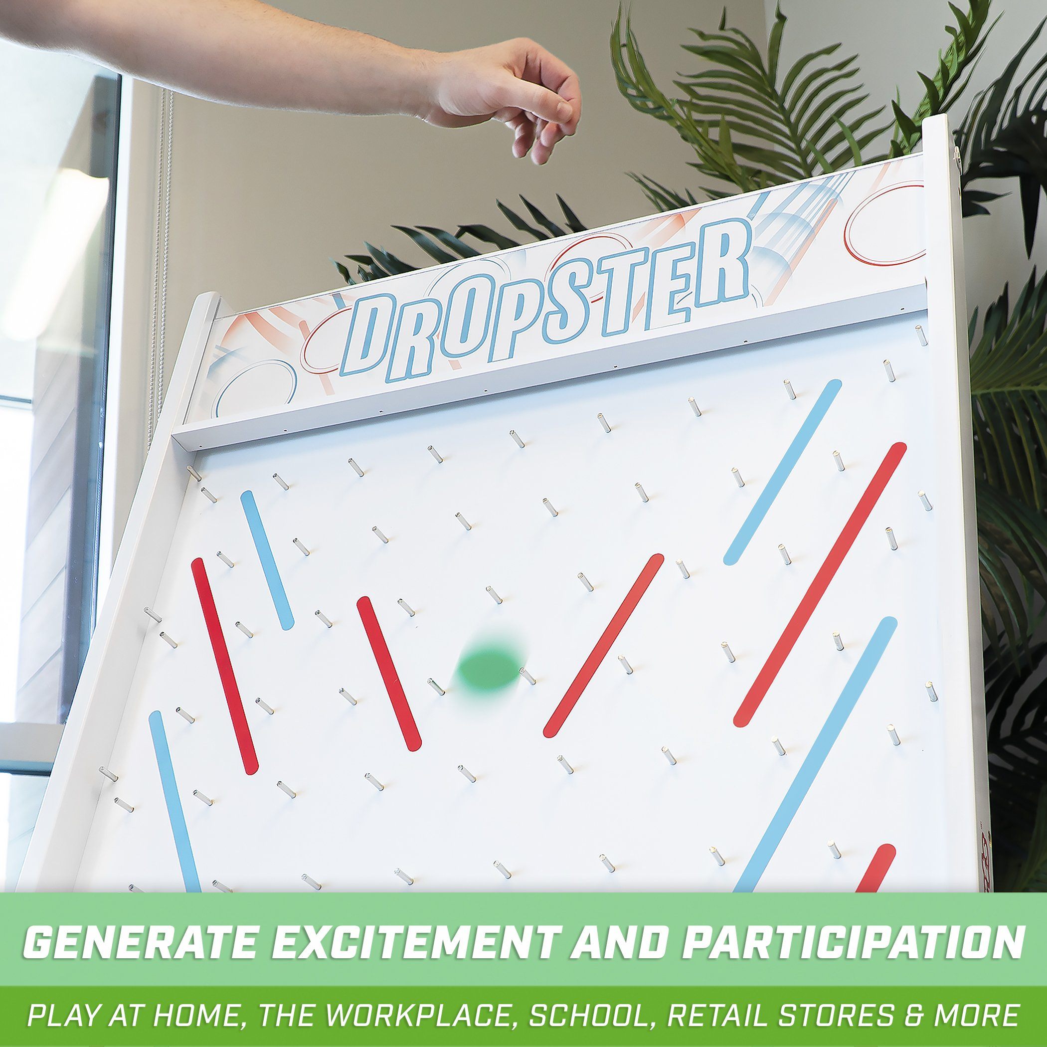 a person is playing a game with a giant air hockey board