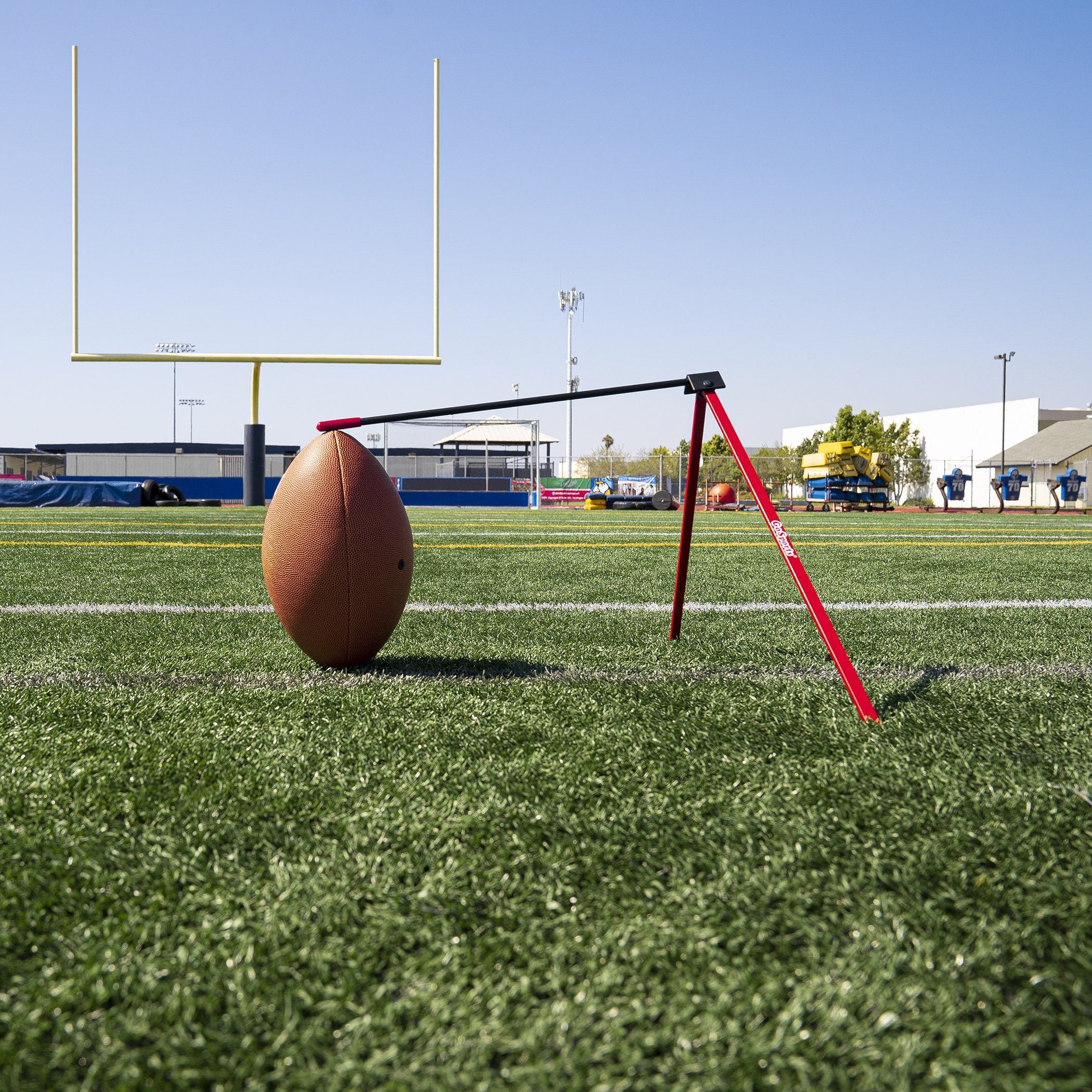 a football on the field with a football goal