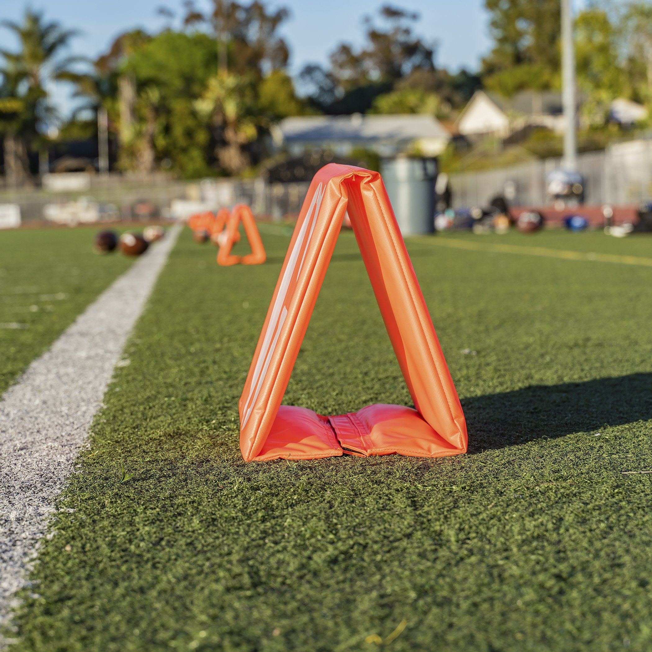 a football field with a red triangle on it