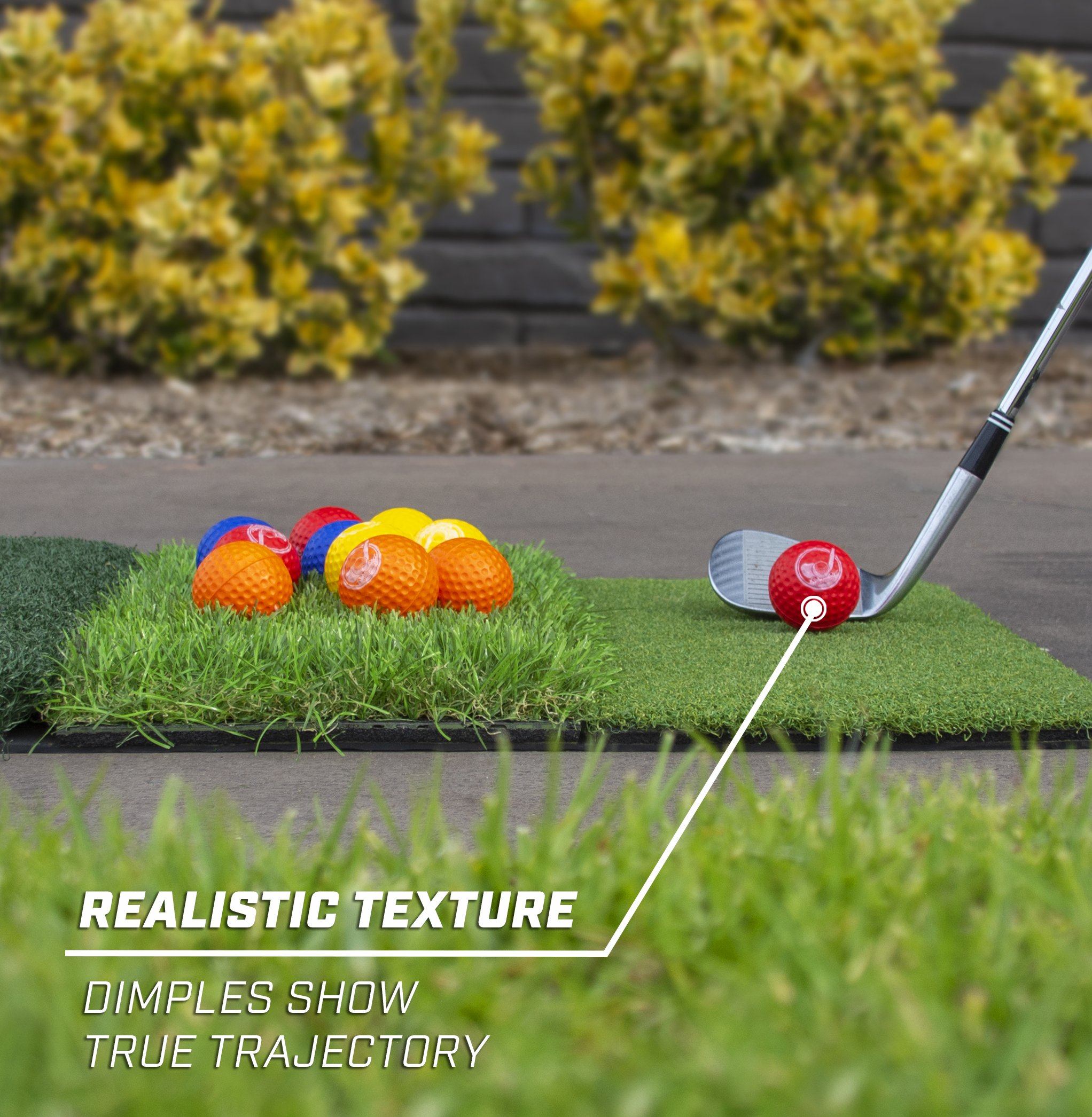 a golf ball and a golf club on the grass