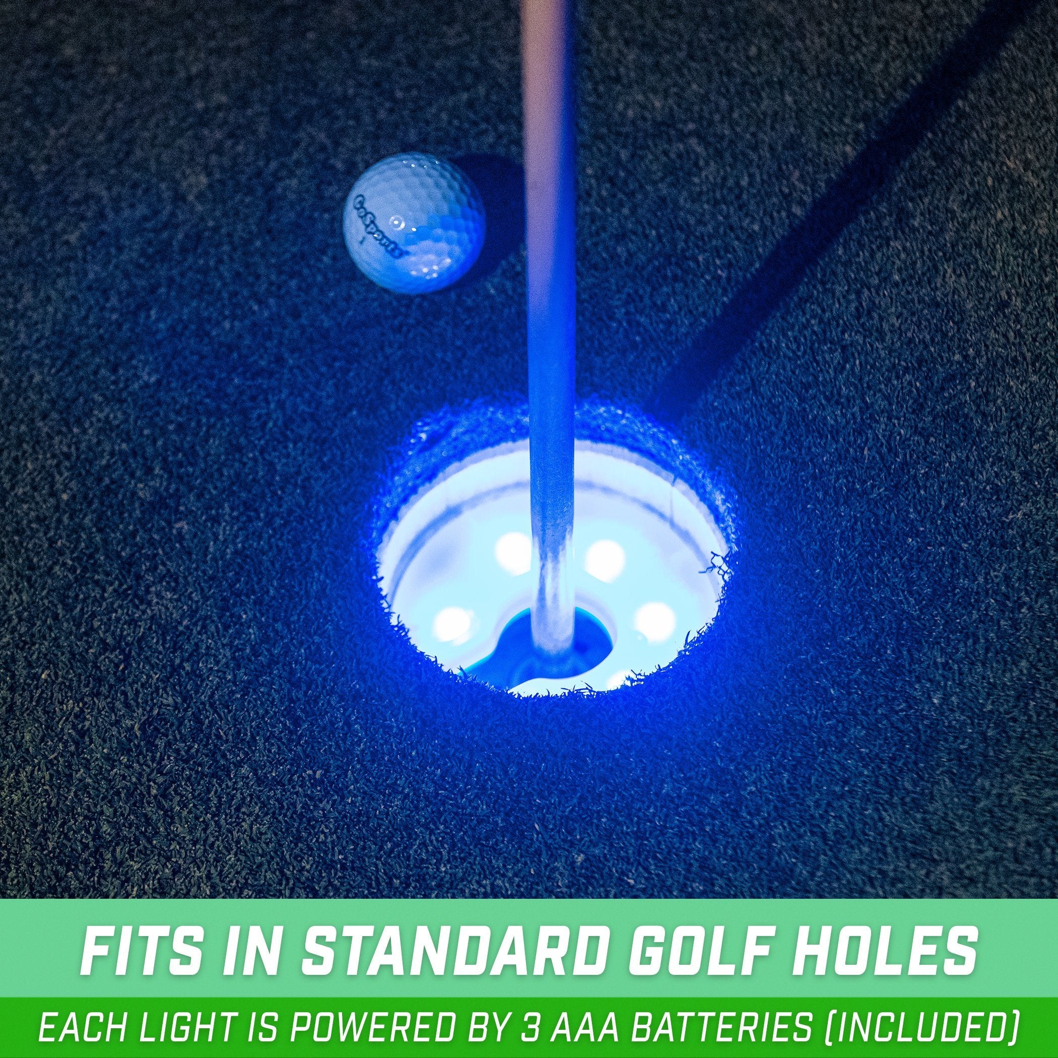 a golf ball is in the hole with a golf club