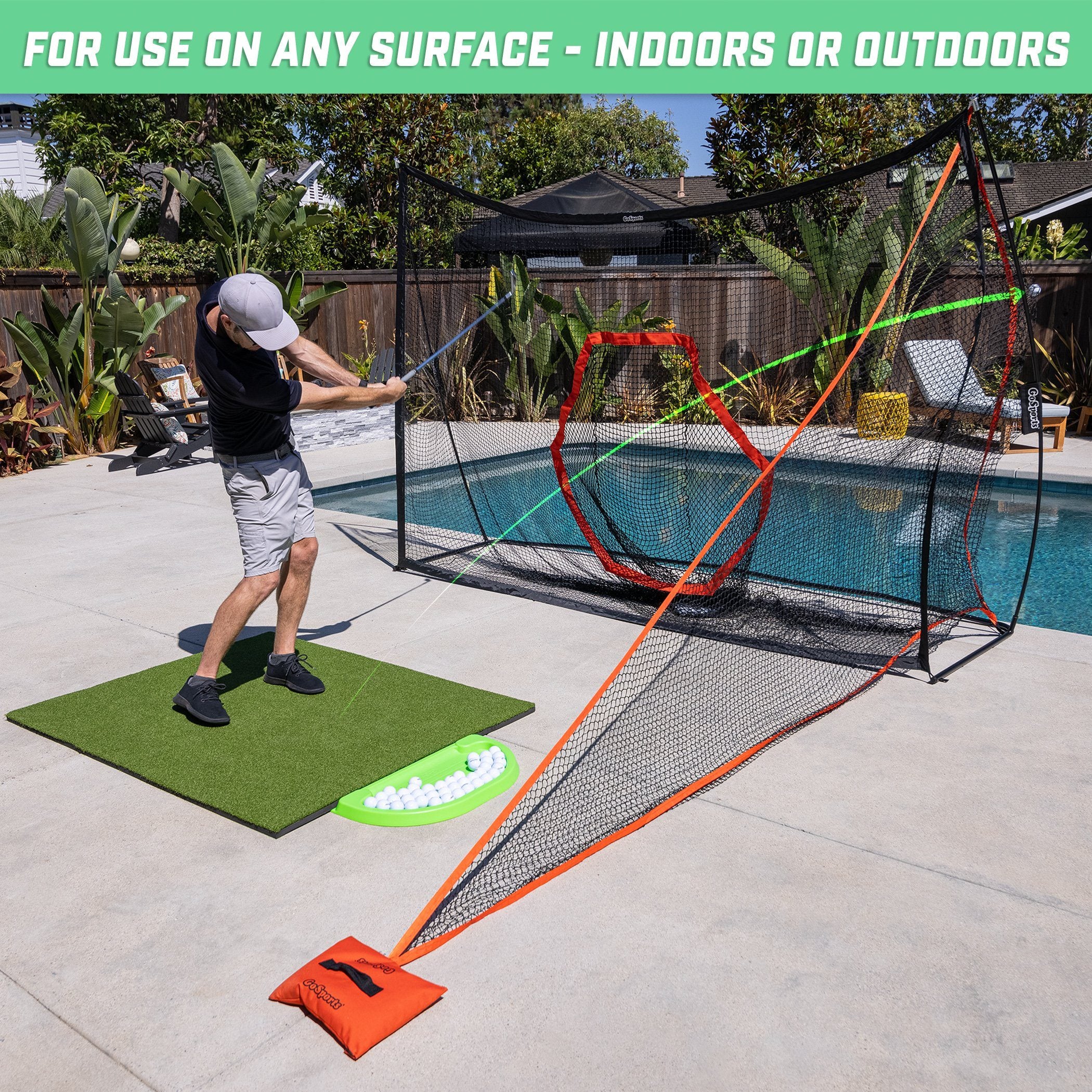 a man is playing with a net and a ball