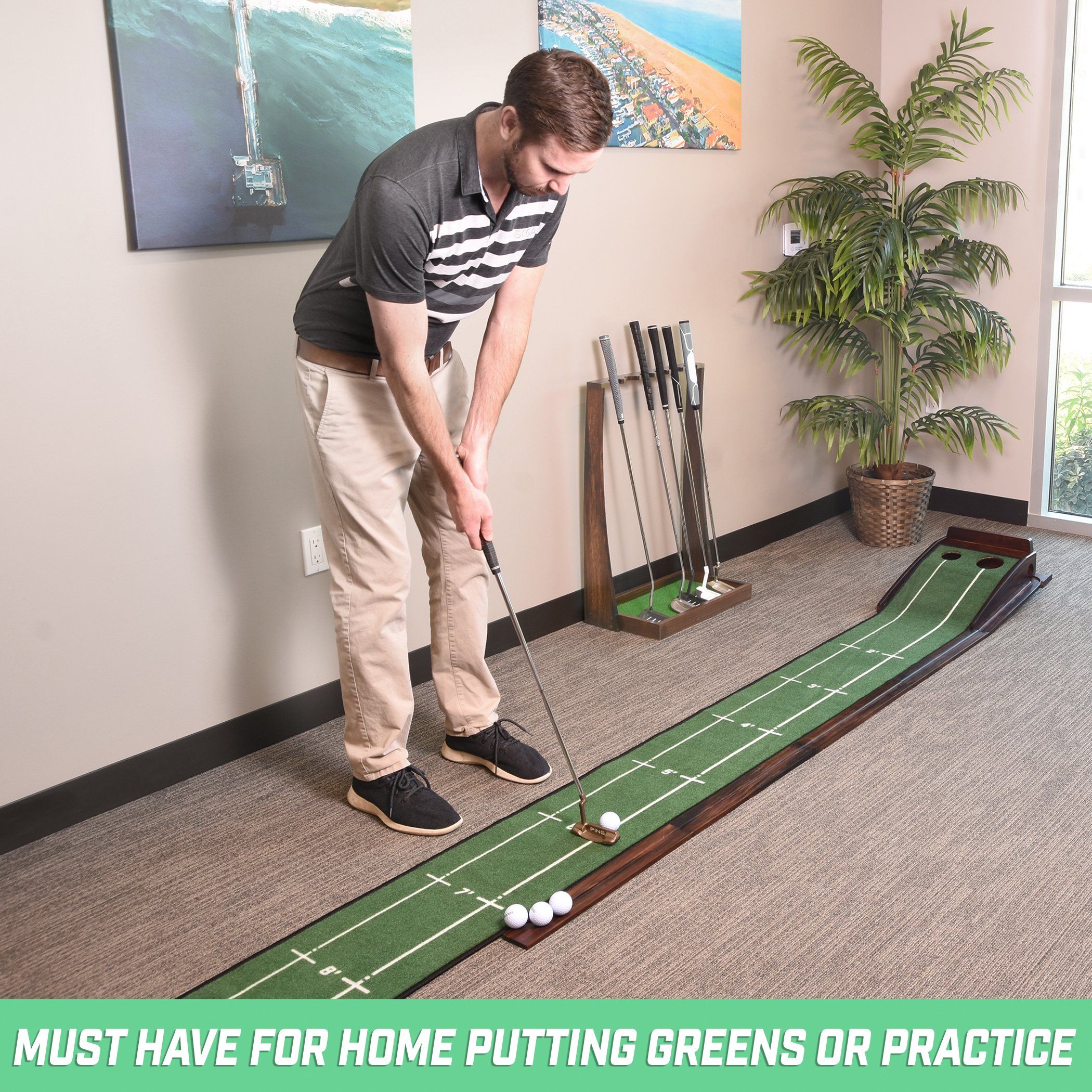 a man putting a golf ball on a putting green