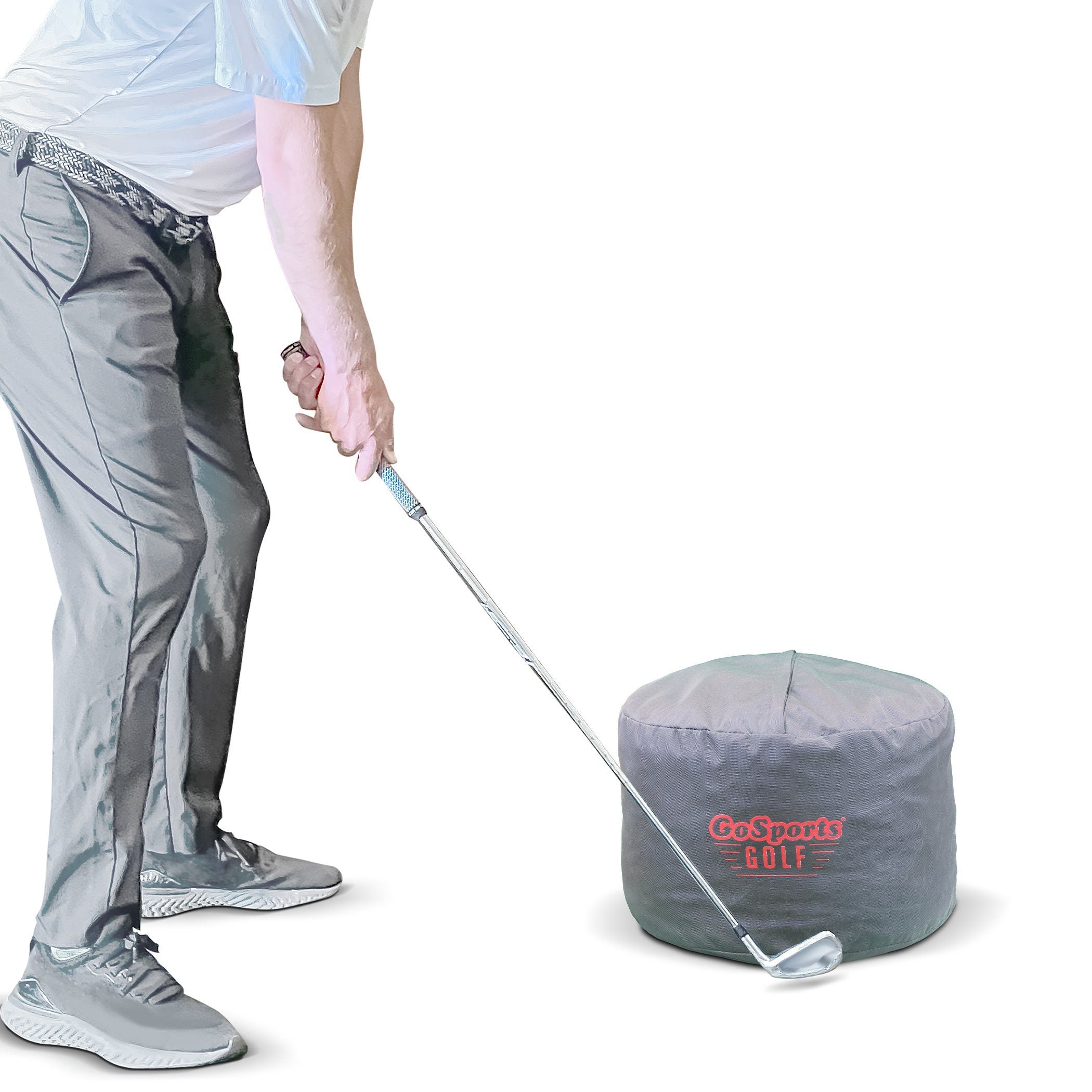 a man putting a golf ball into a bag