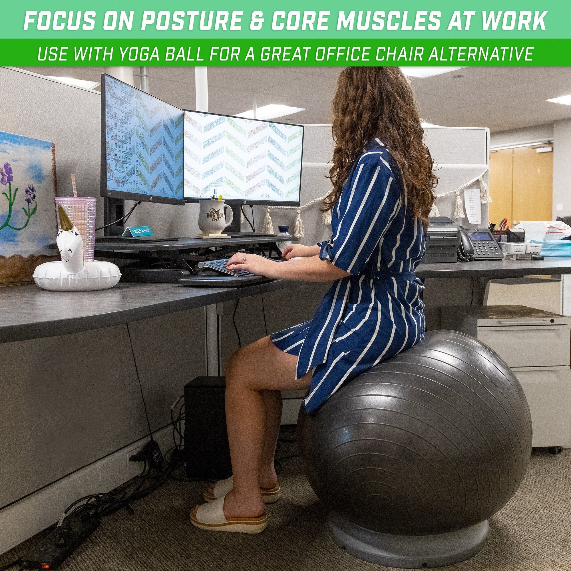 a woman sitting on a ball in an office