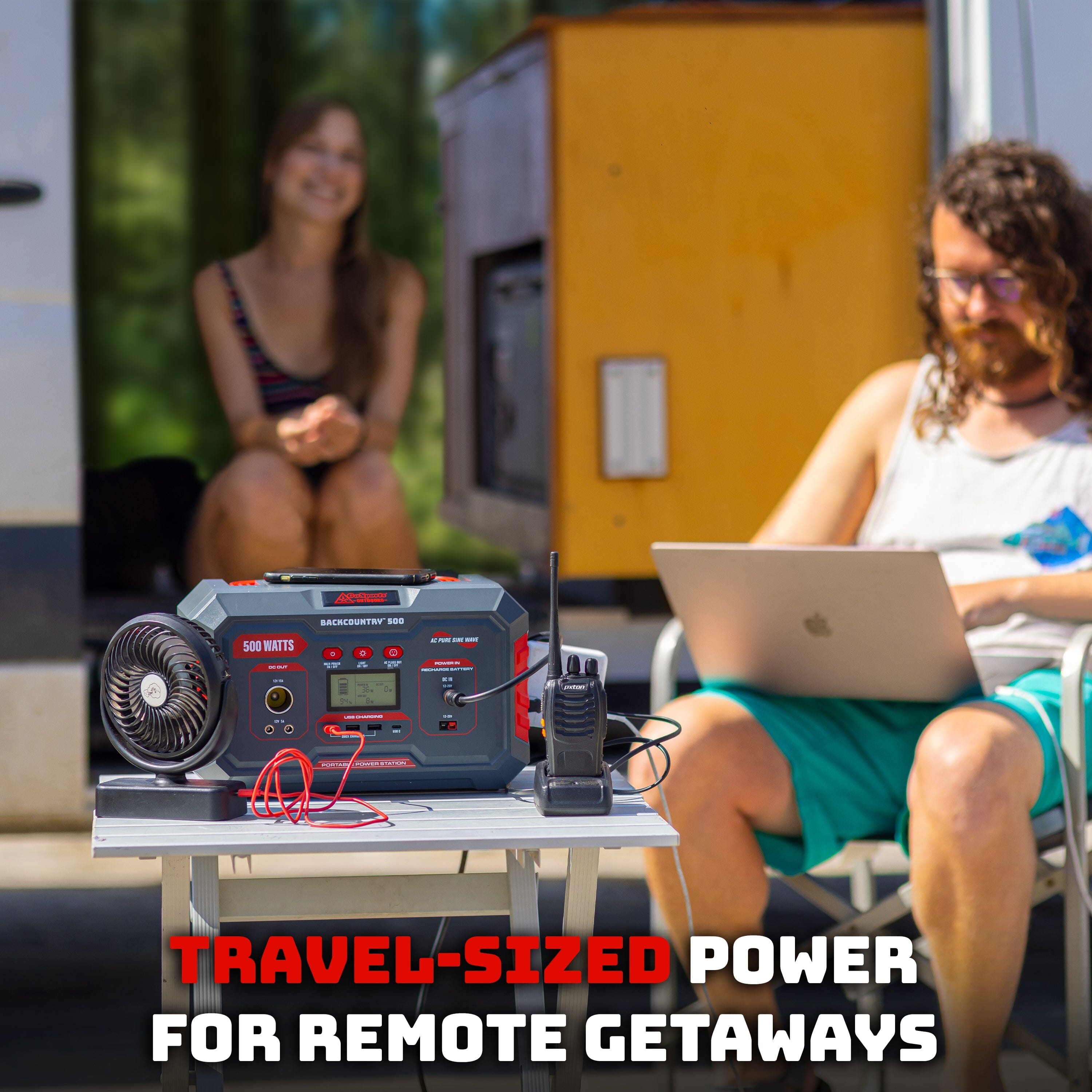 a man sitting in a chair with a laptop