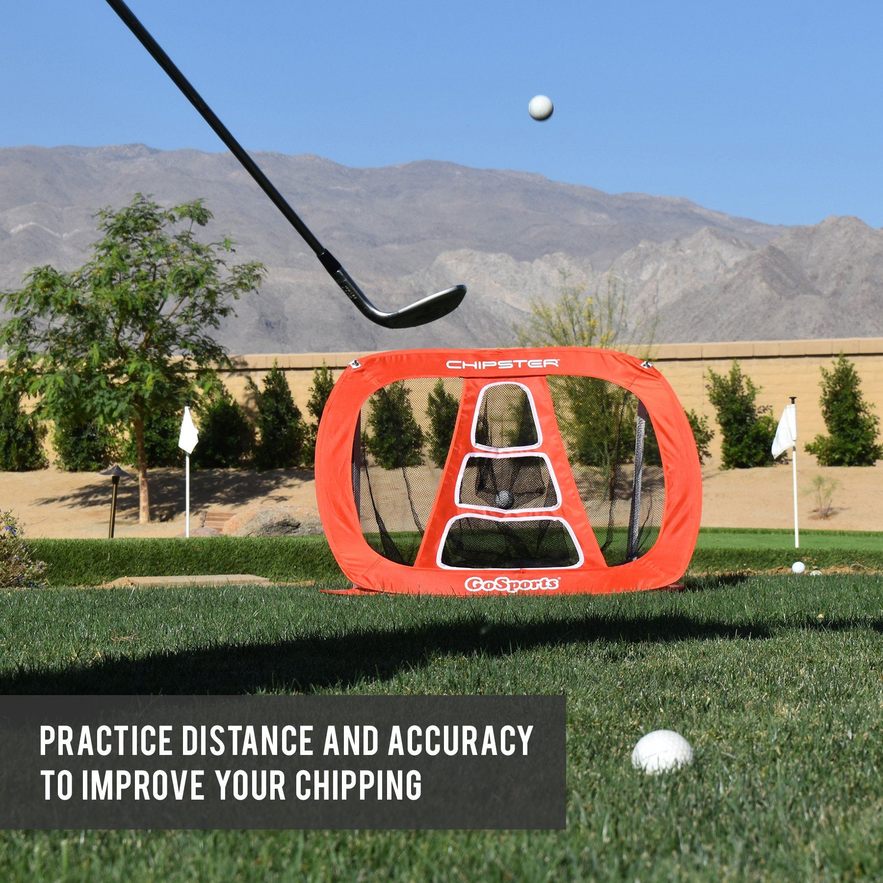 a golf ball is in the hole with a golf club in the background