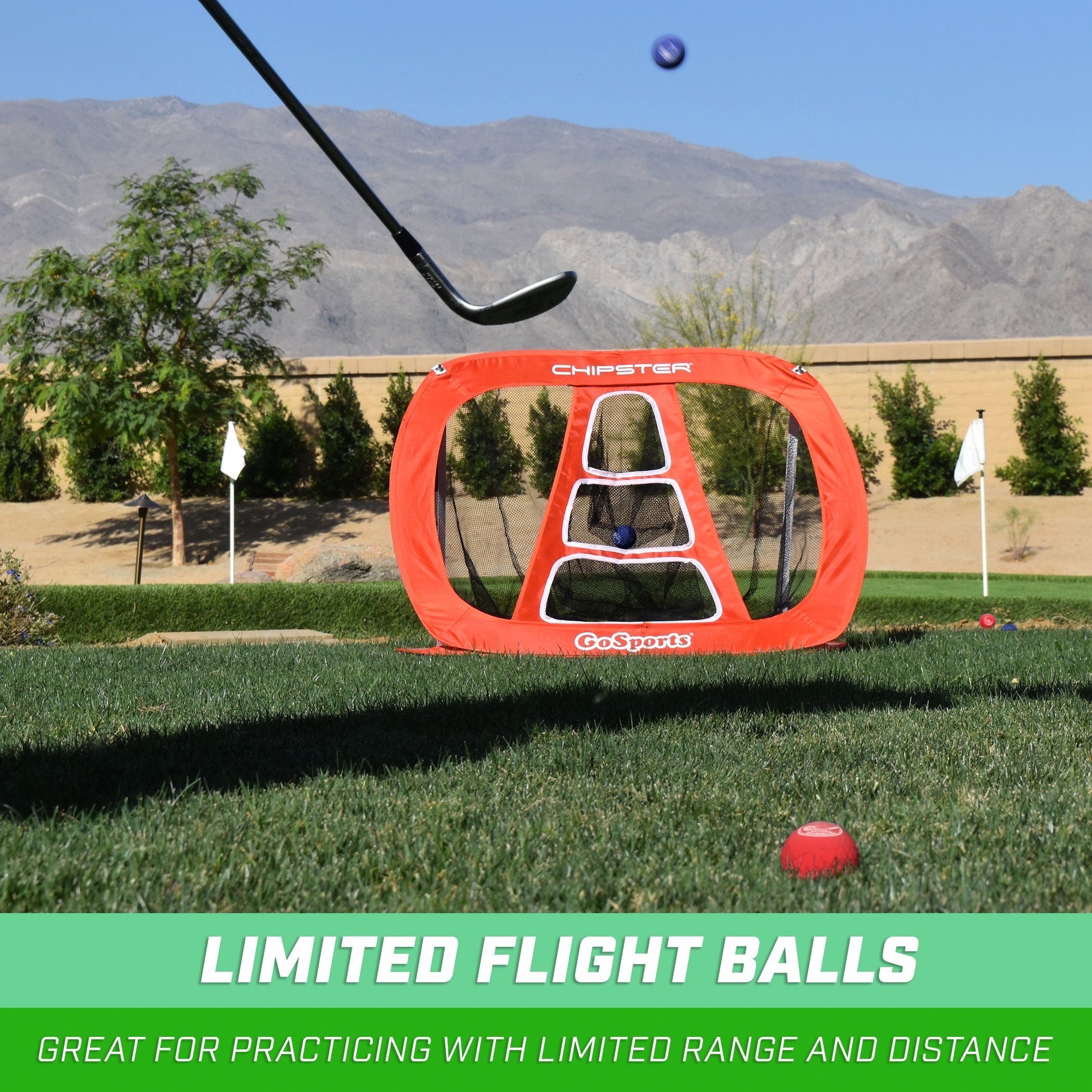 a man hitting a ball with a golf club