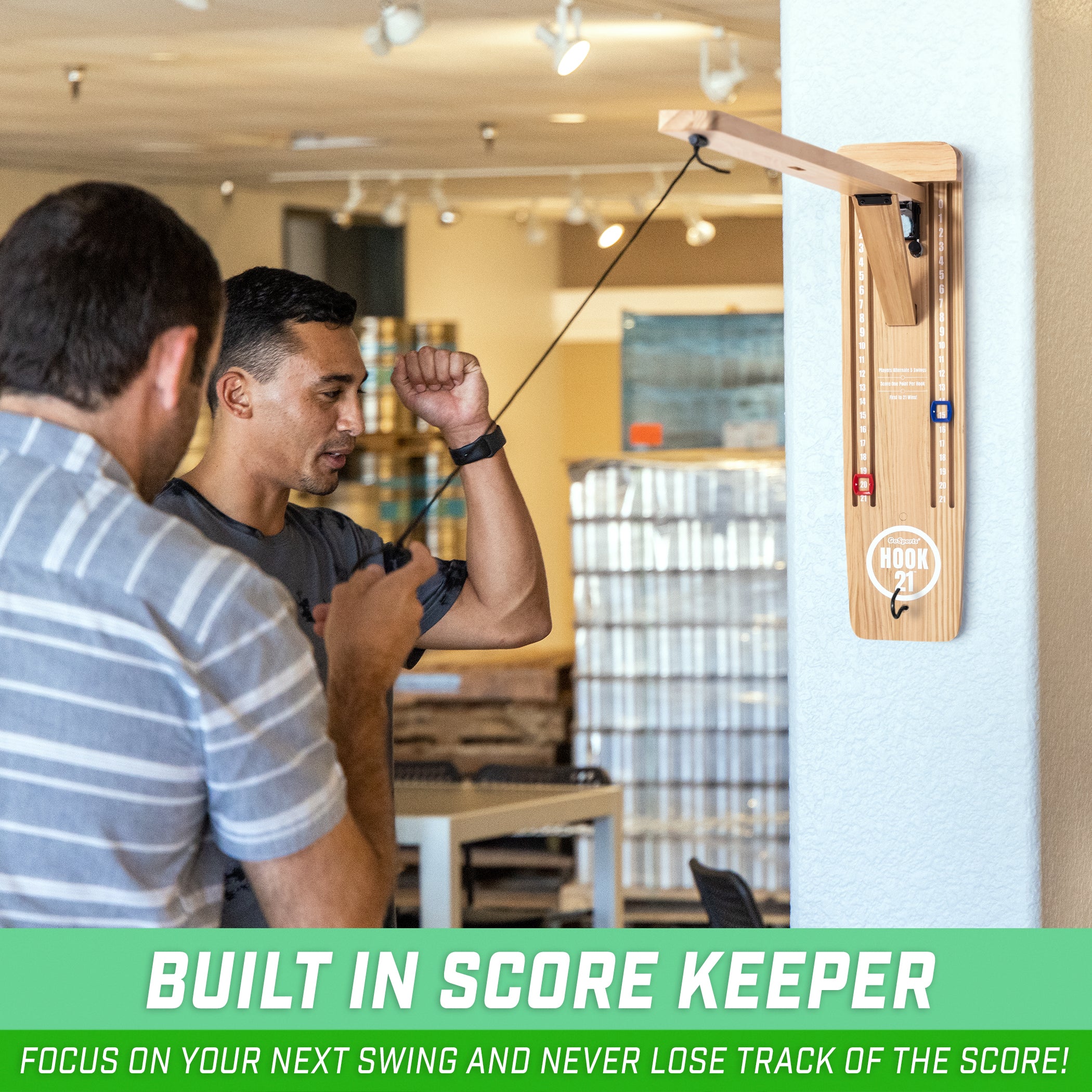 a man is holding a stick and looking at a wall