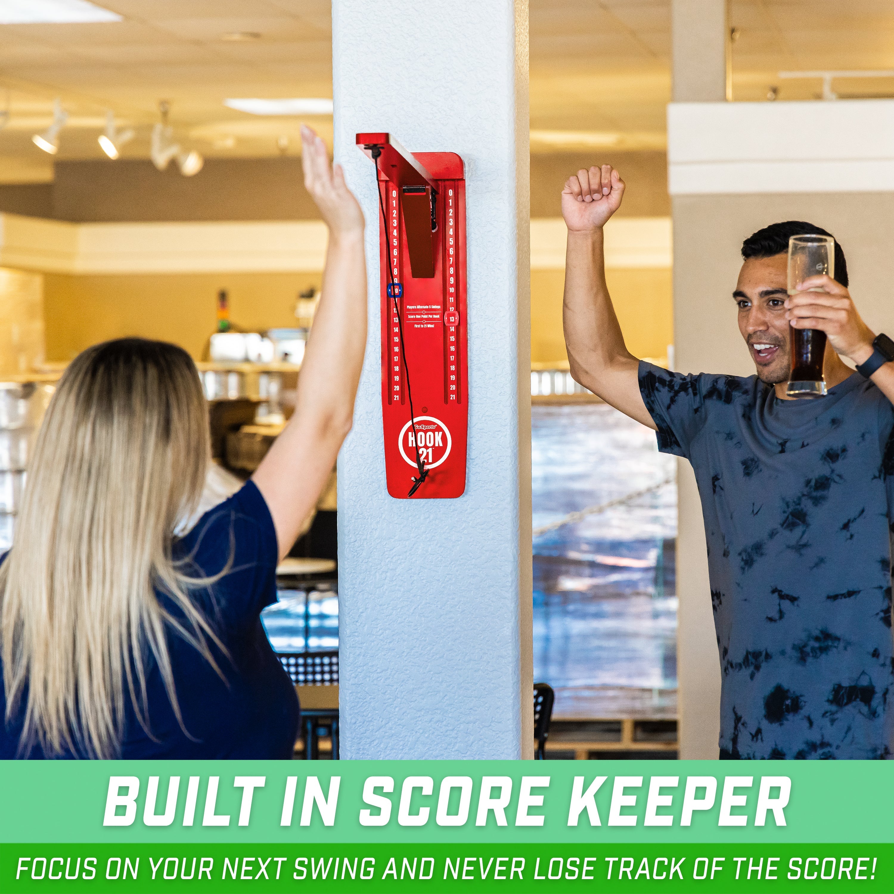 a man and woman holding up a red sign