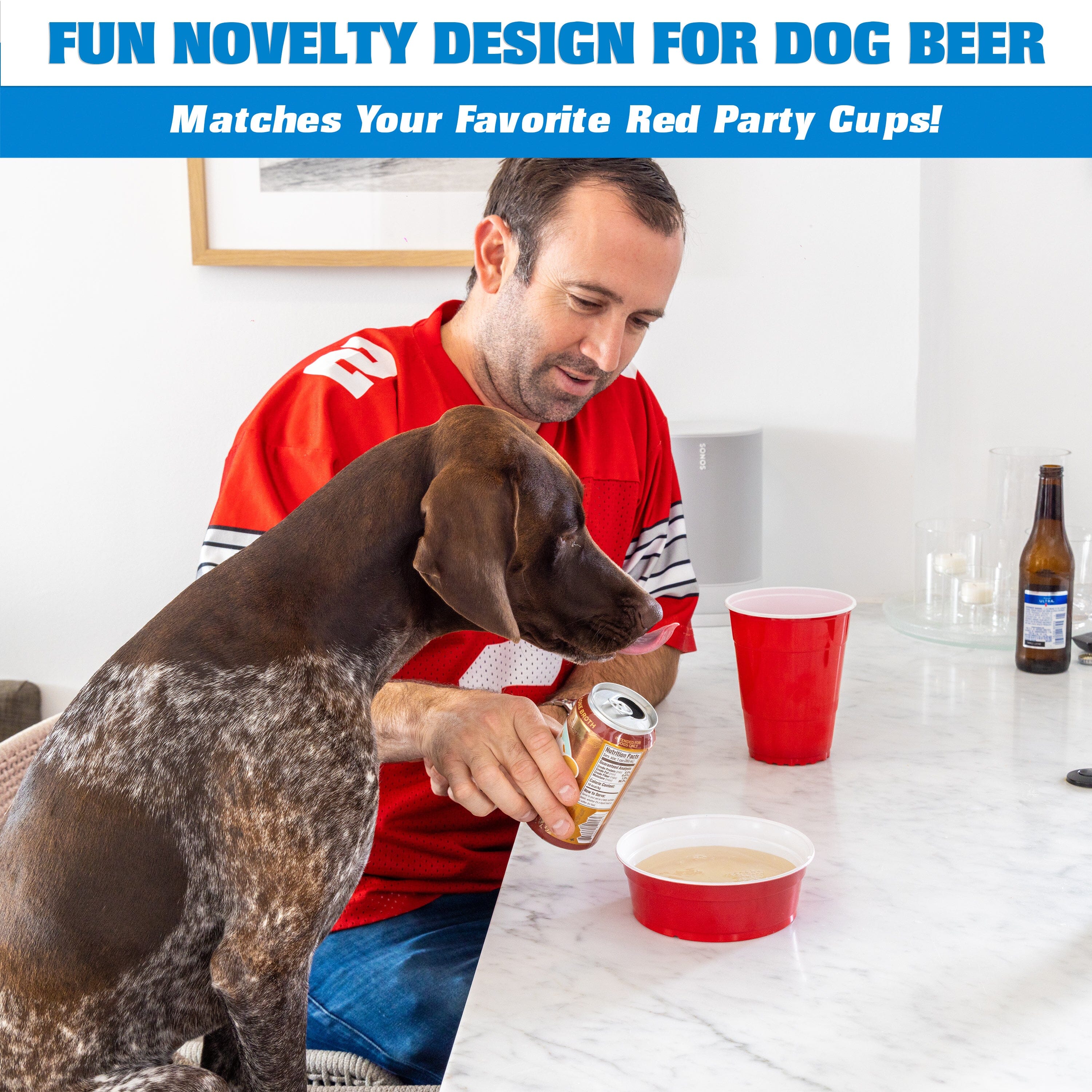 a man sitting at a table with a dog