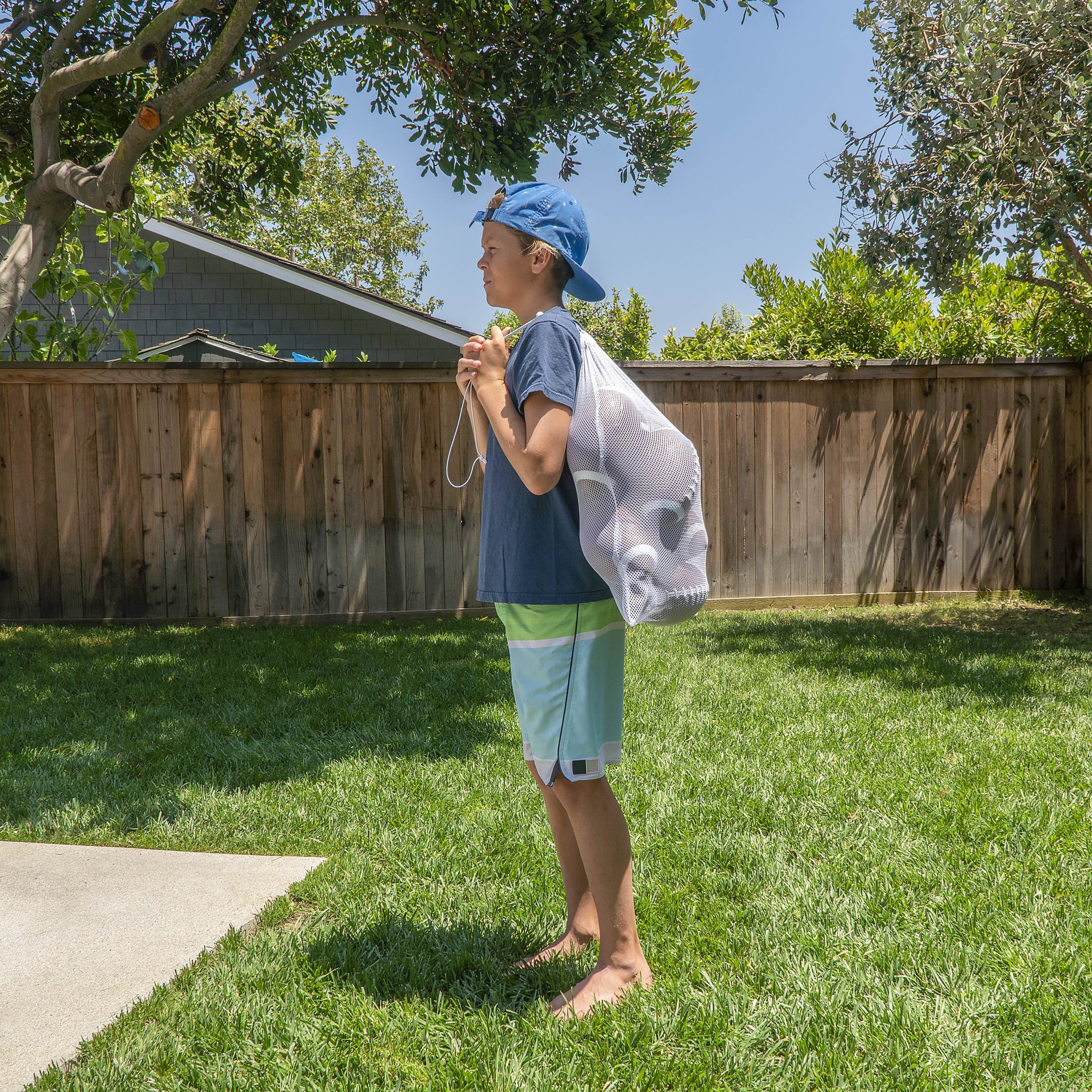 a boy standing in the grass with a froth of a fr fr fr fr fr fr fr