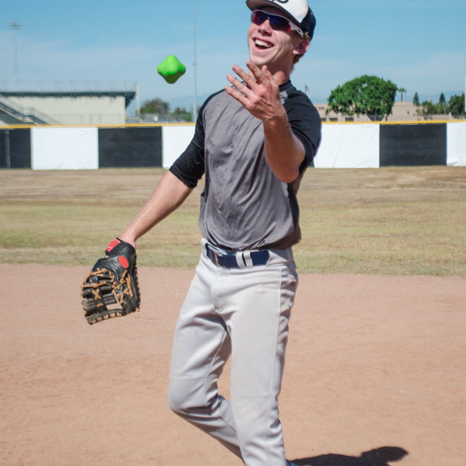 a man in a baseball uniform throwing a ball