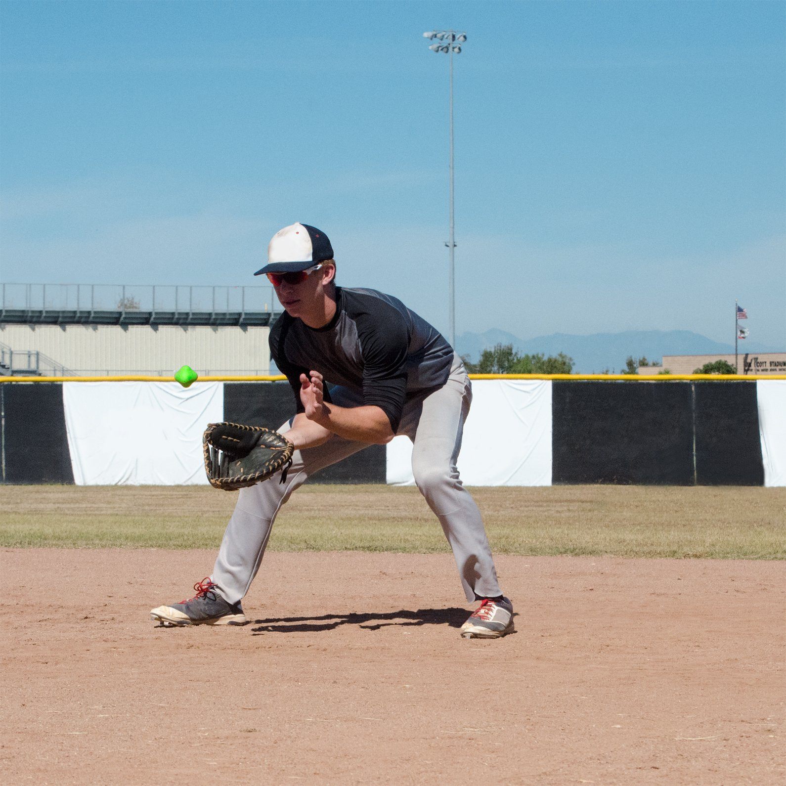 a man in a baseball uniform is throwing a ball