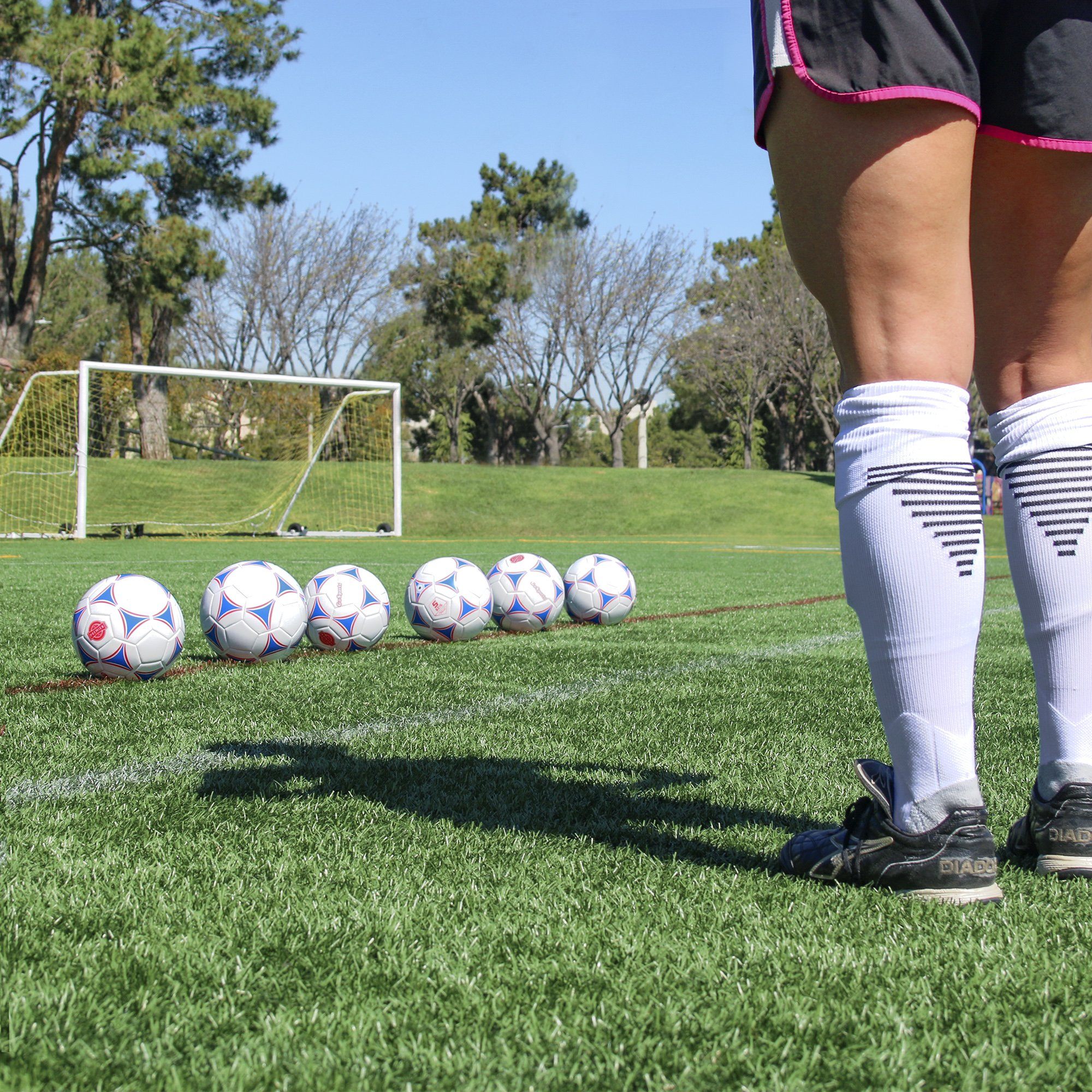 a soccer player standing on a soccer field