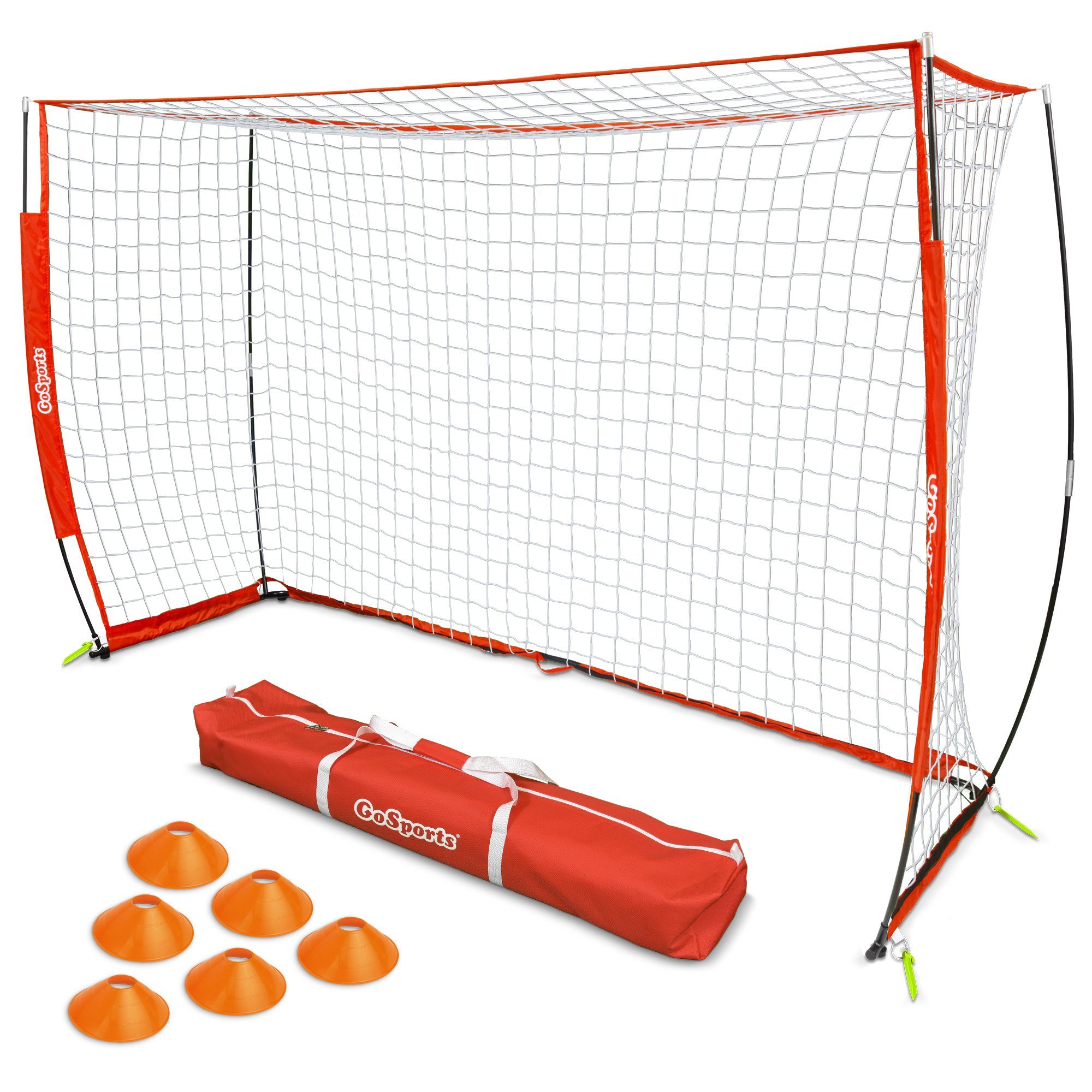 a soccer goal with orange balls and a bag