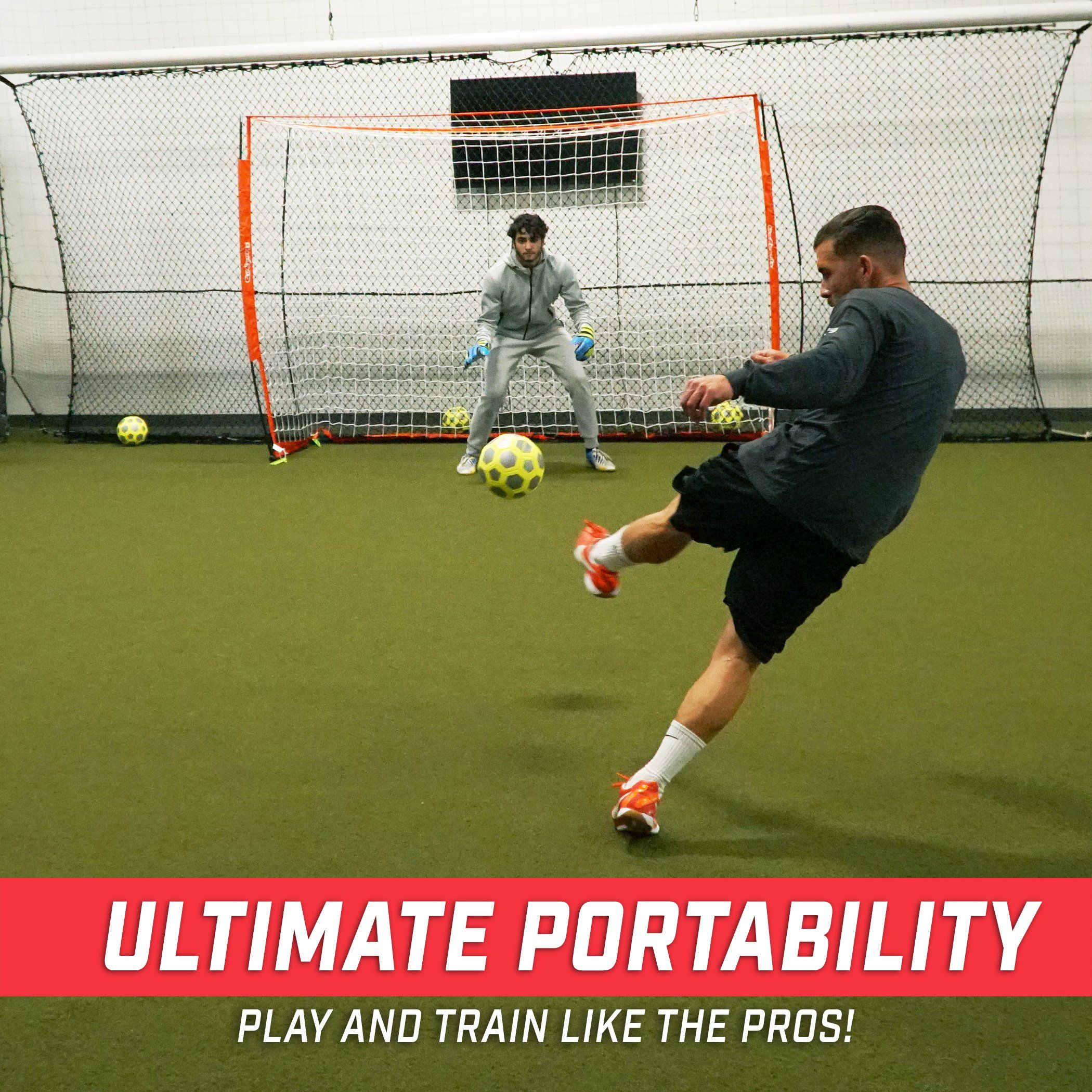 a man kicking a soccer ball in a soccer field