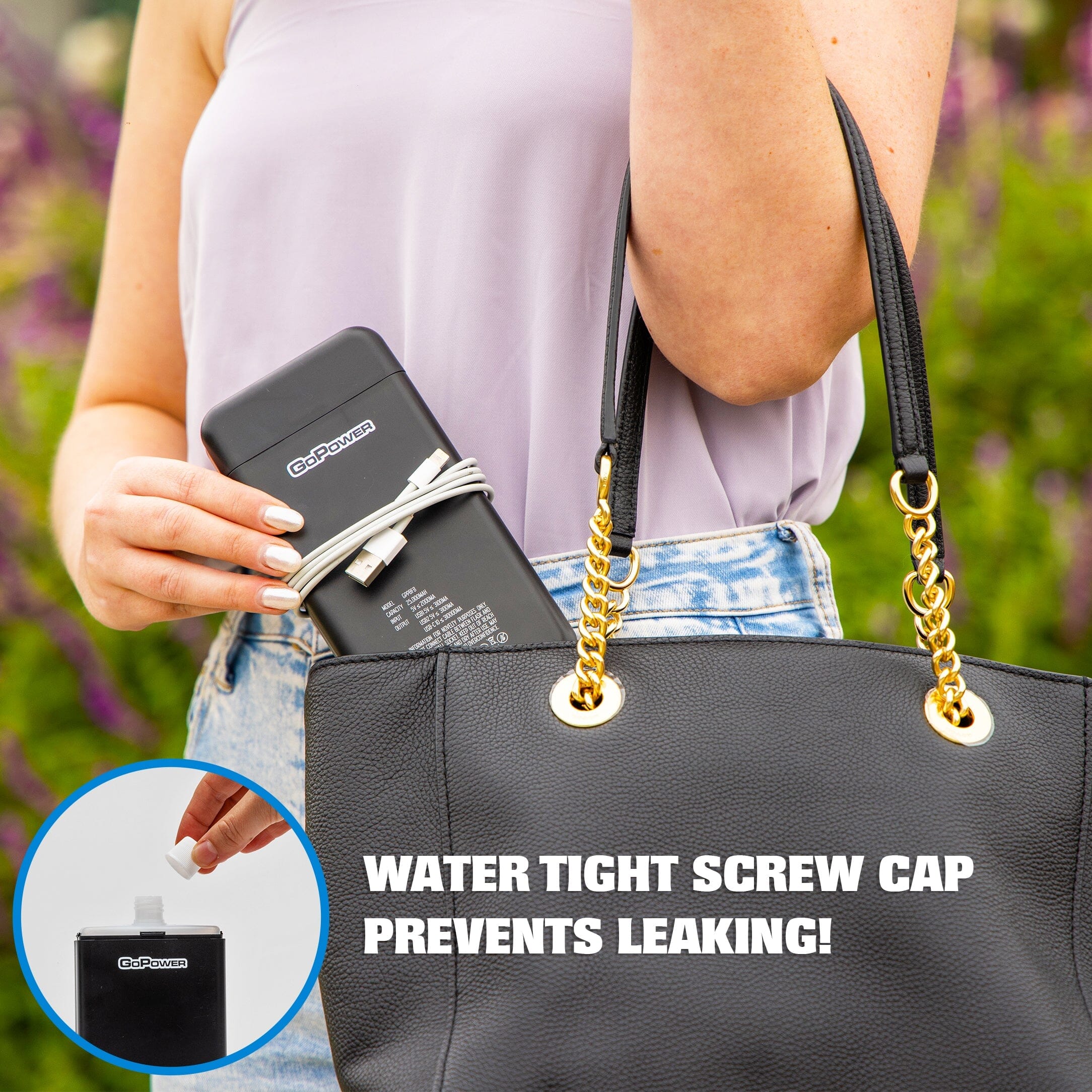 a woman holding a purse and a cell phone