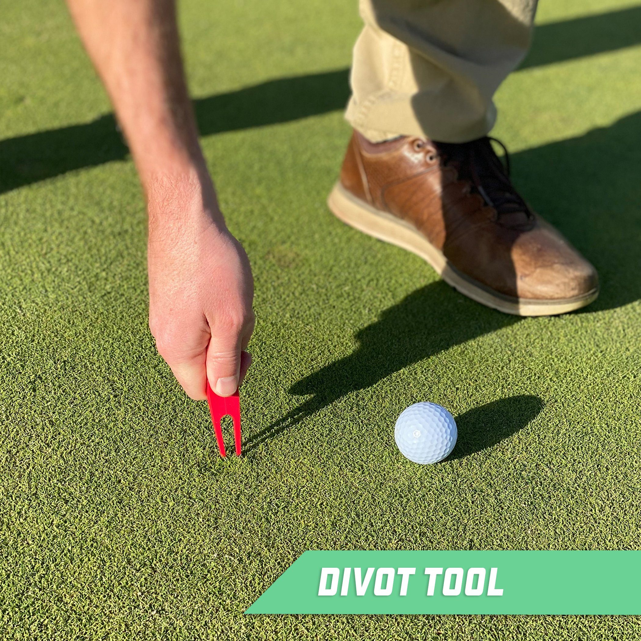 a man putting a golf ball on the green