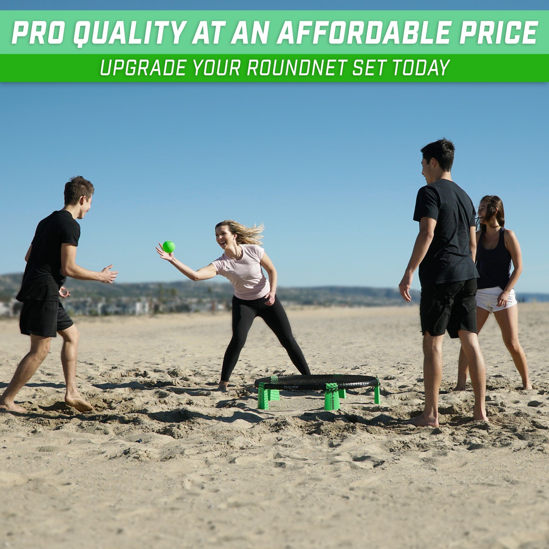 group of people playing ball on the beach